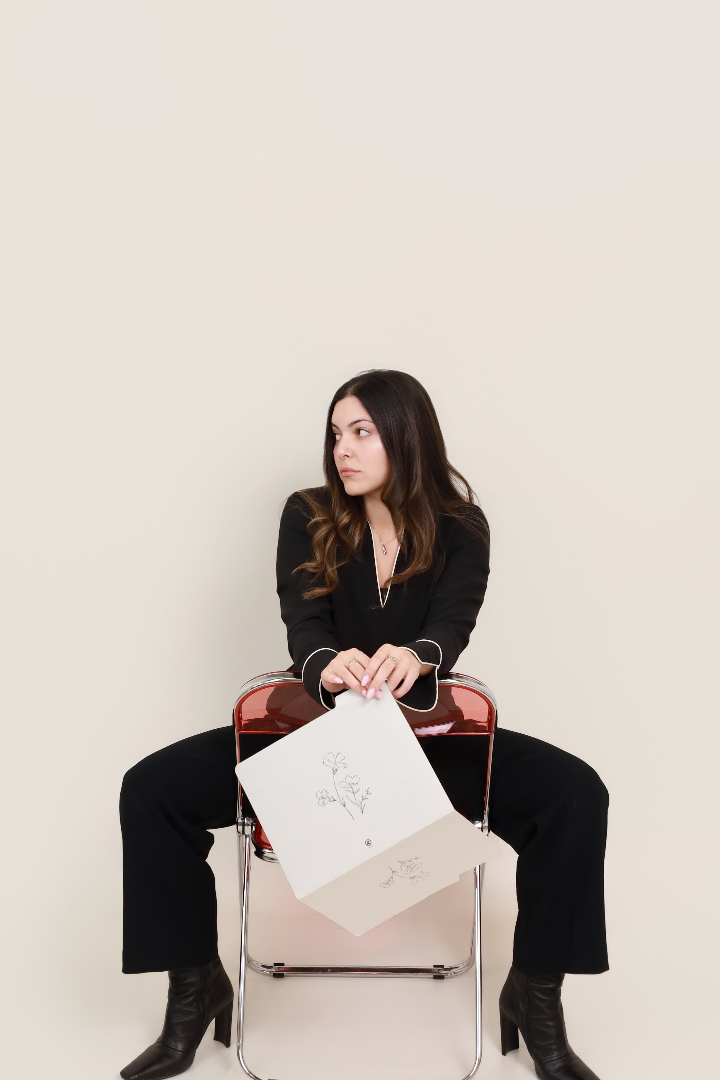 Erika Baibachaev, Baib Aesthetic Studios. woman sitting in chair