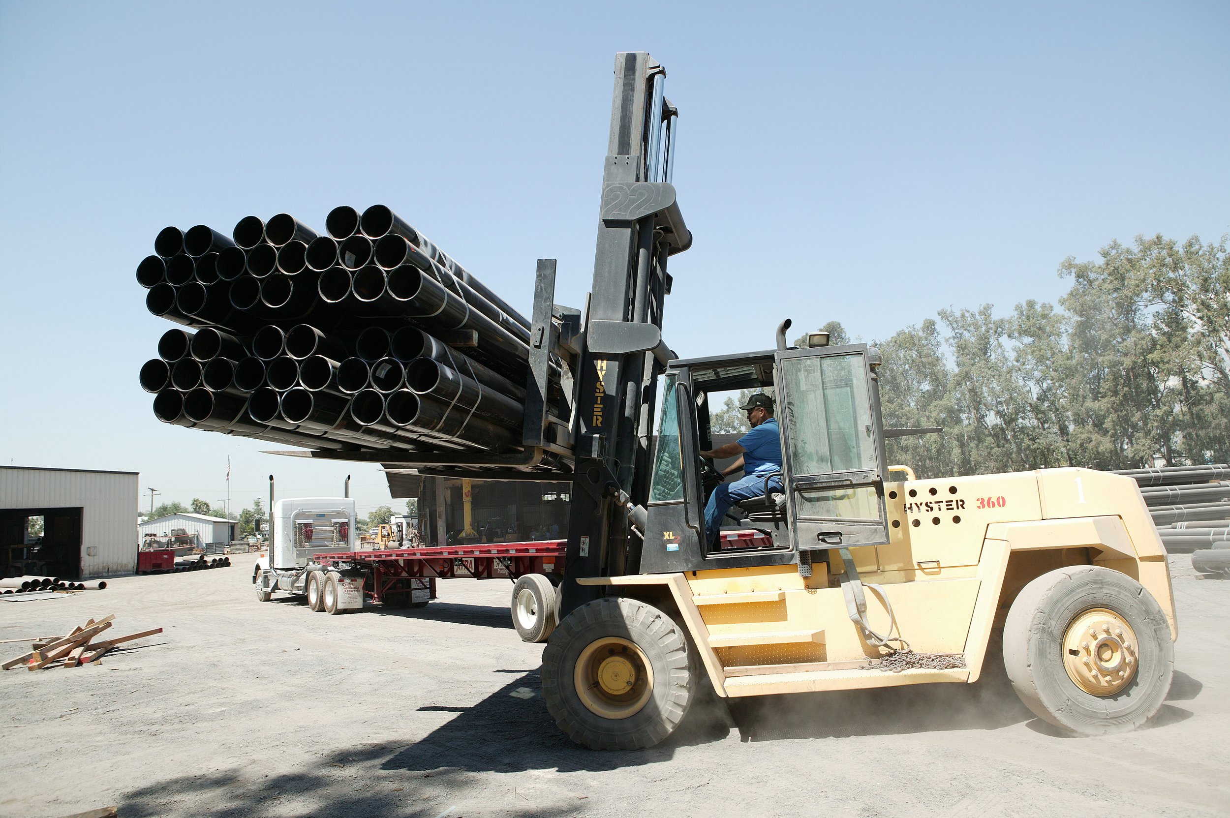 101 pipes being carried by forklift