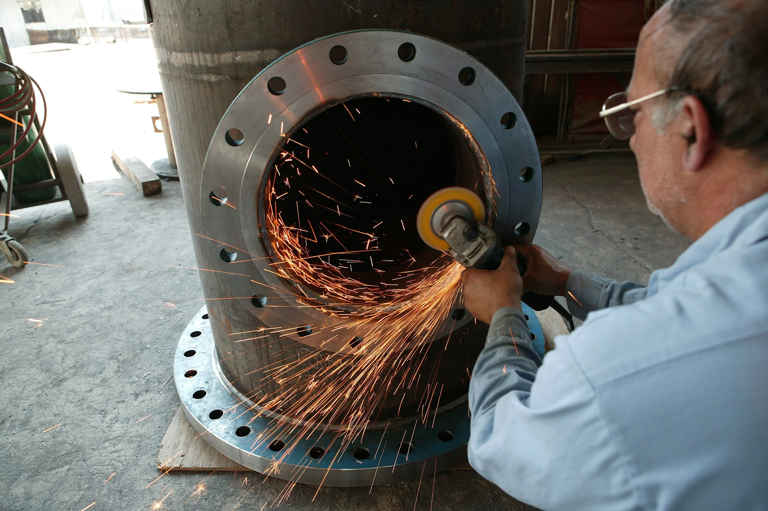 man custom fabricating a pipe