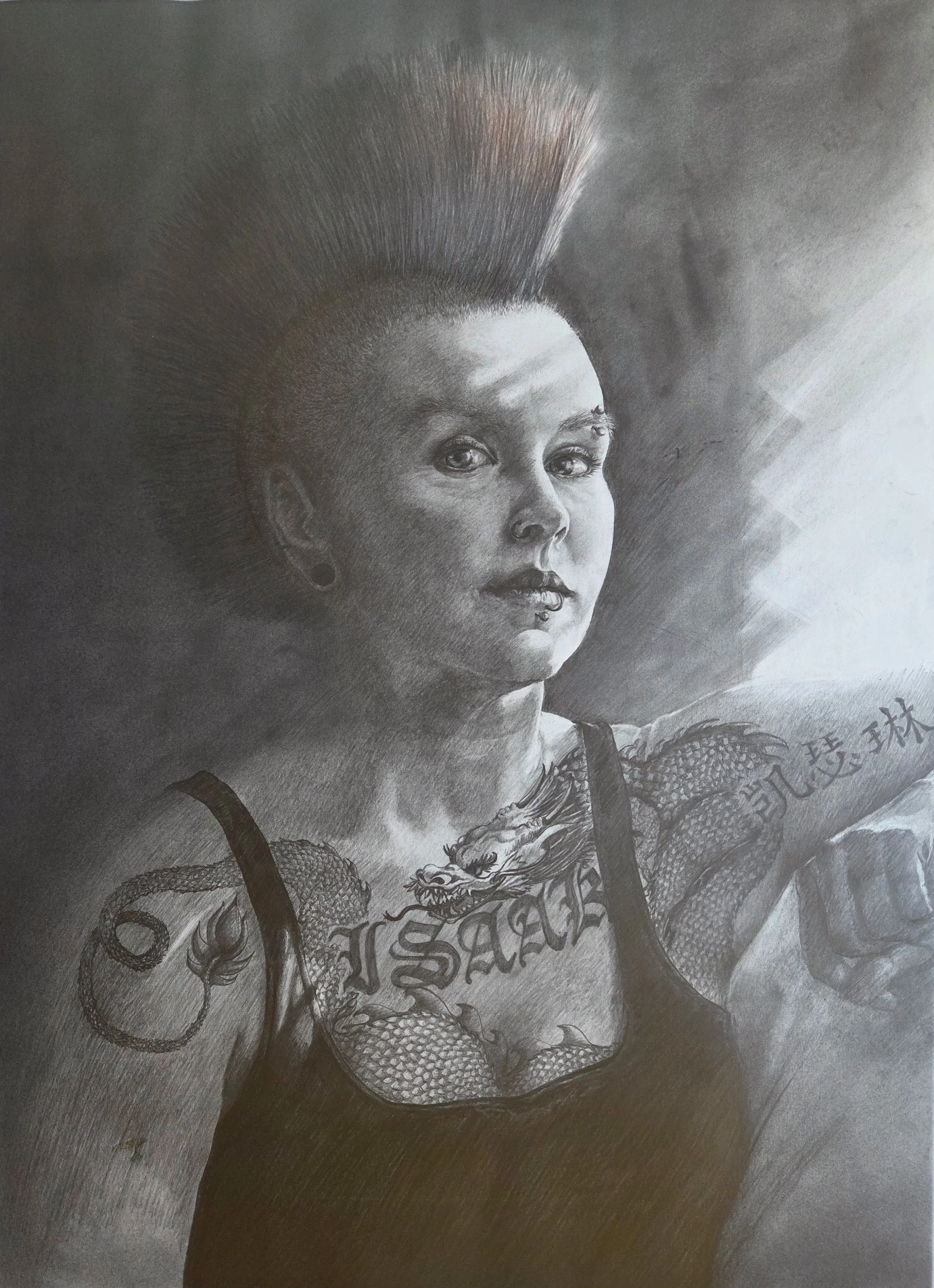 A black and white pencil sketch of a woman with a mohawk hairstyle, tattoos on her chest and arms, and tattoos on her face.