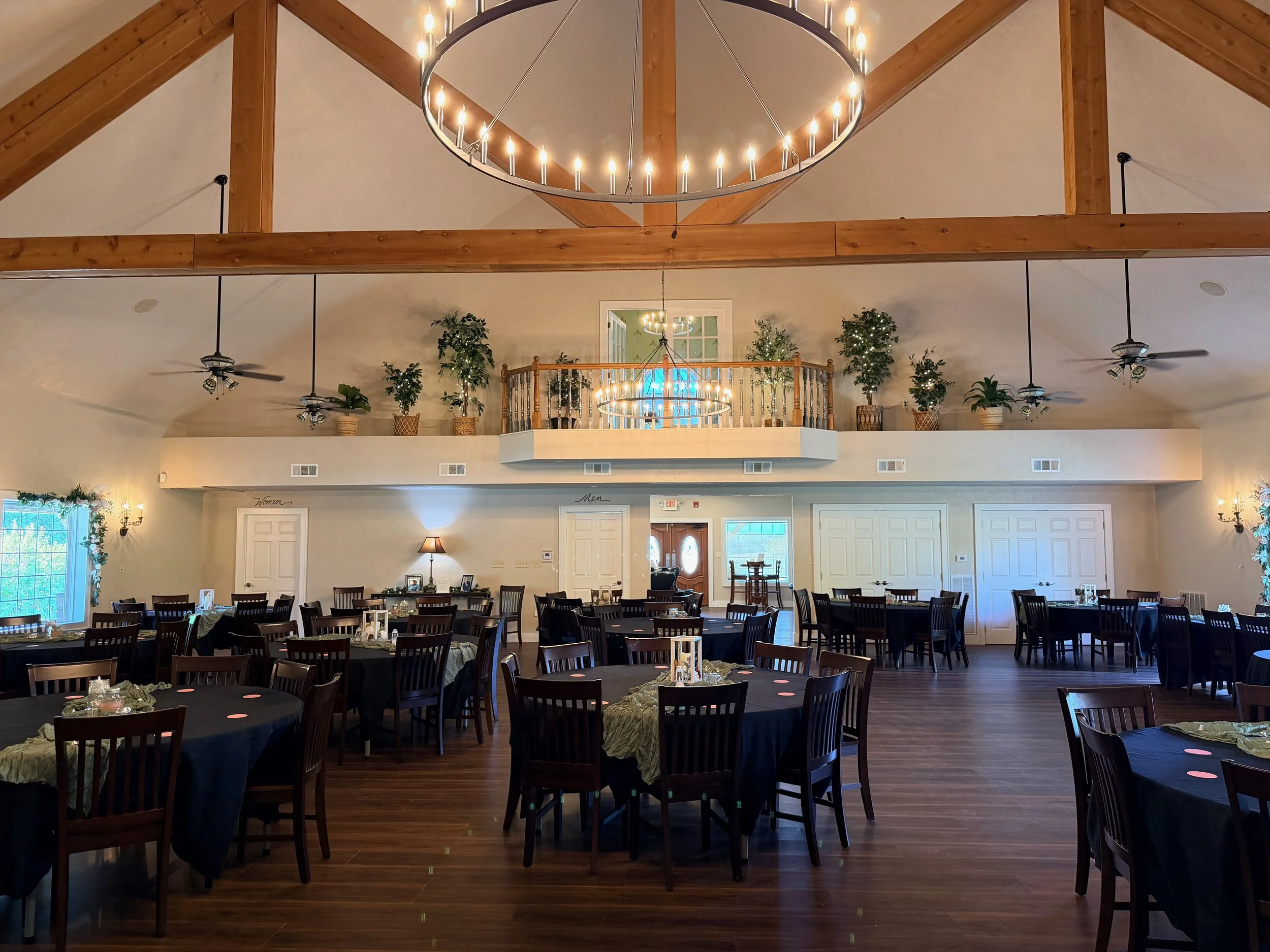 Indoor reception hall at The Valley Event Center set with tables for a wedding