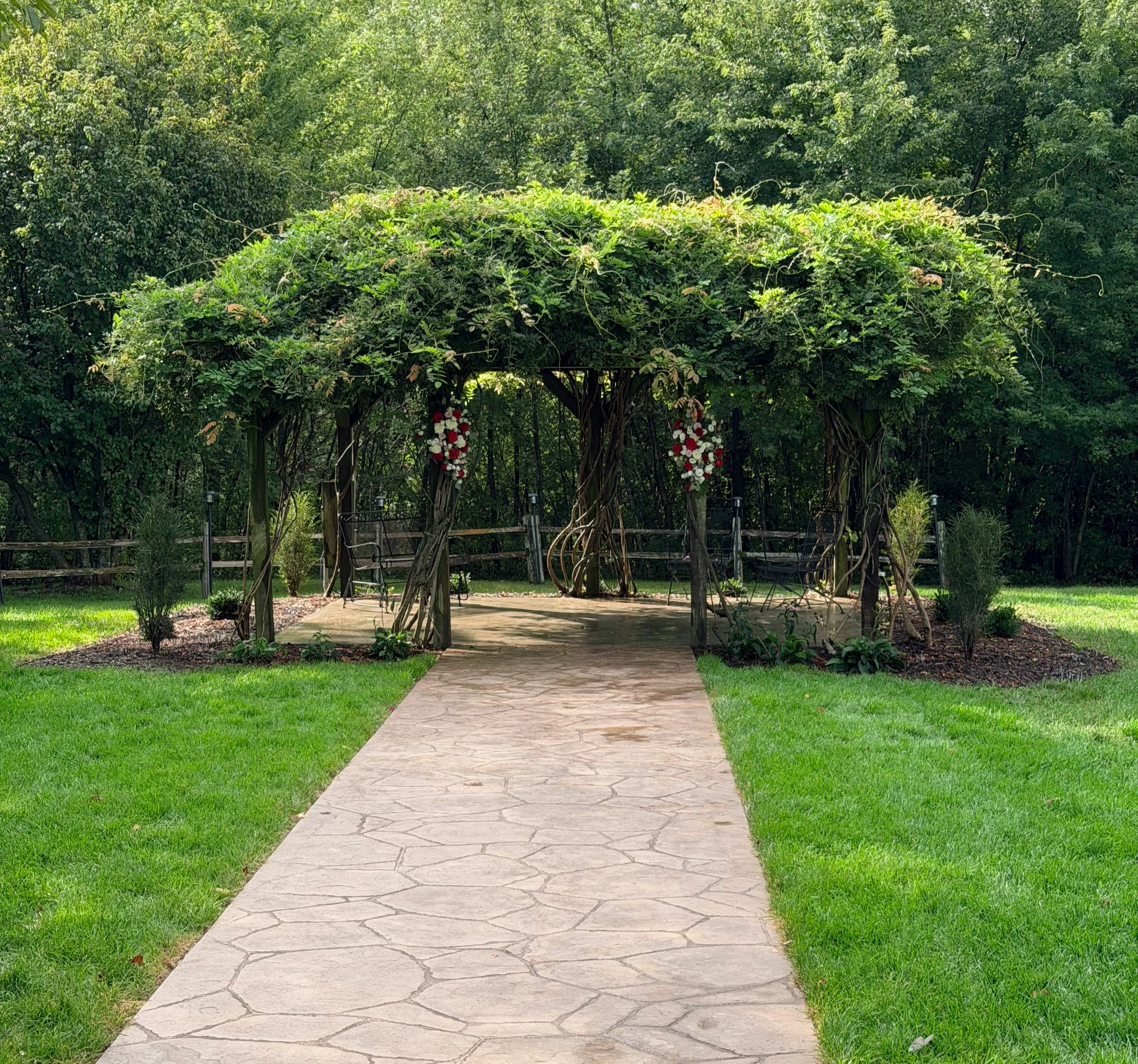 Outdoor wedding ceremony site with countryside views at The Valley Event Center