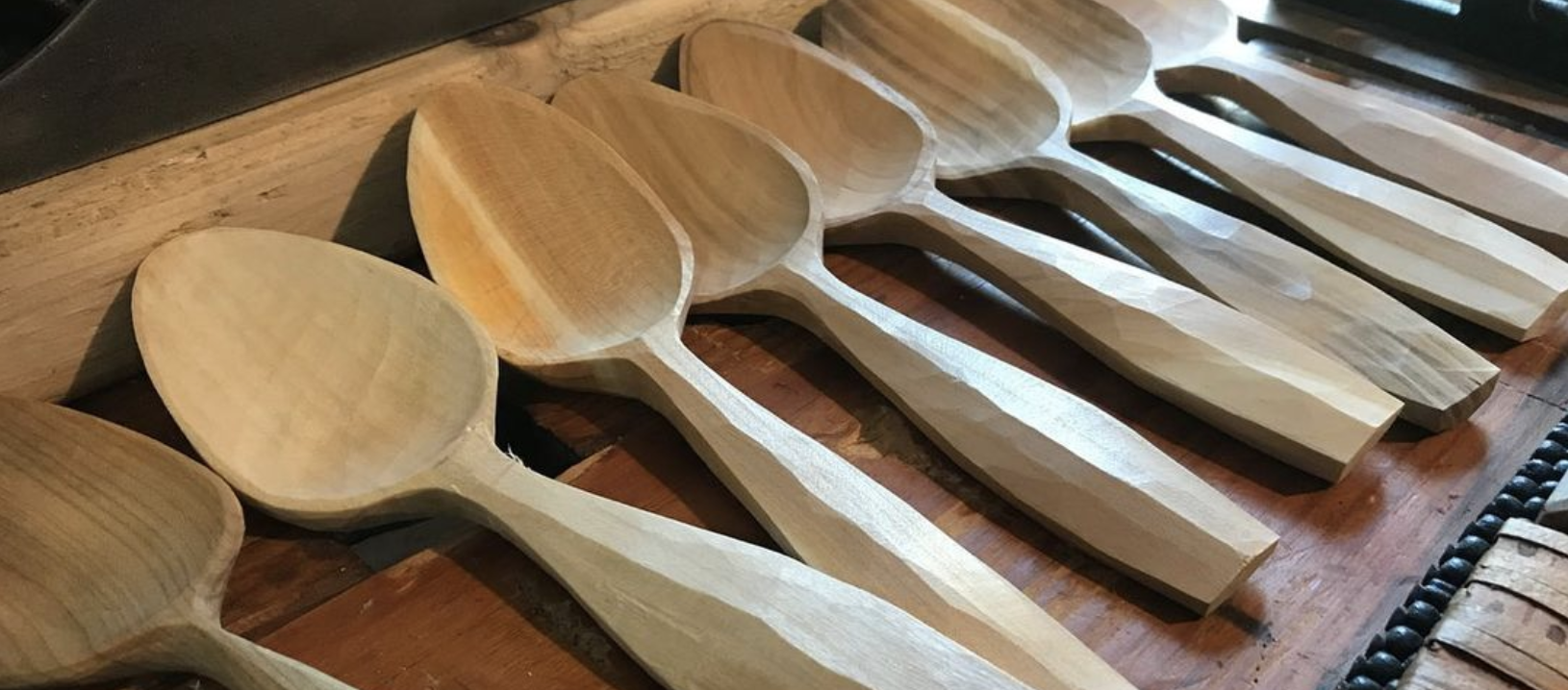 A row of hand-carved spoons.