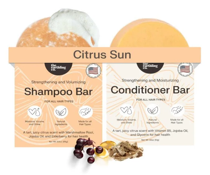 Shampoo and conditioner bar set labeled Citrus Sun with natural ingredients displayed.