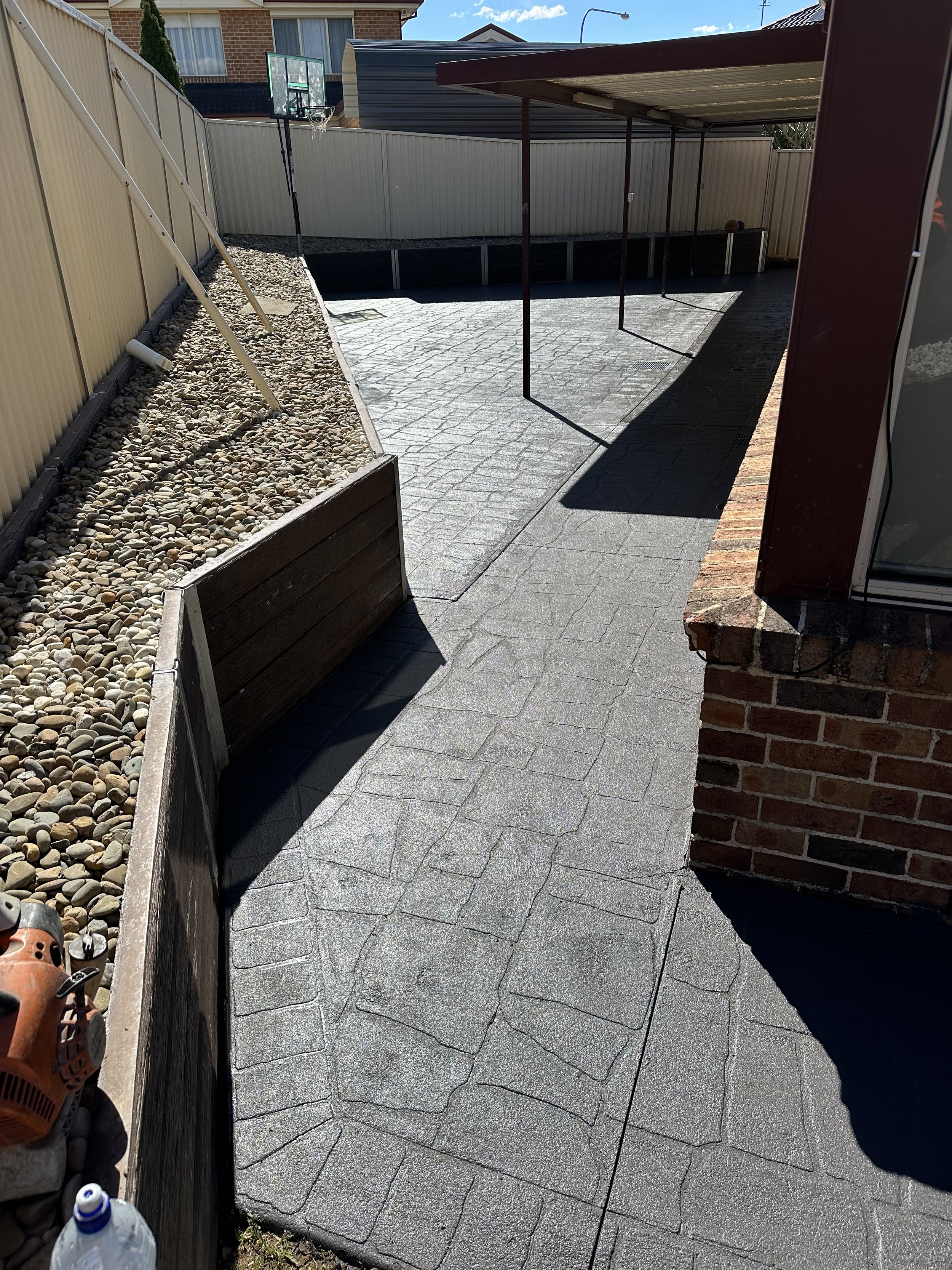 Backyard with stamped concrete patio