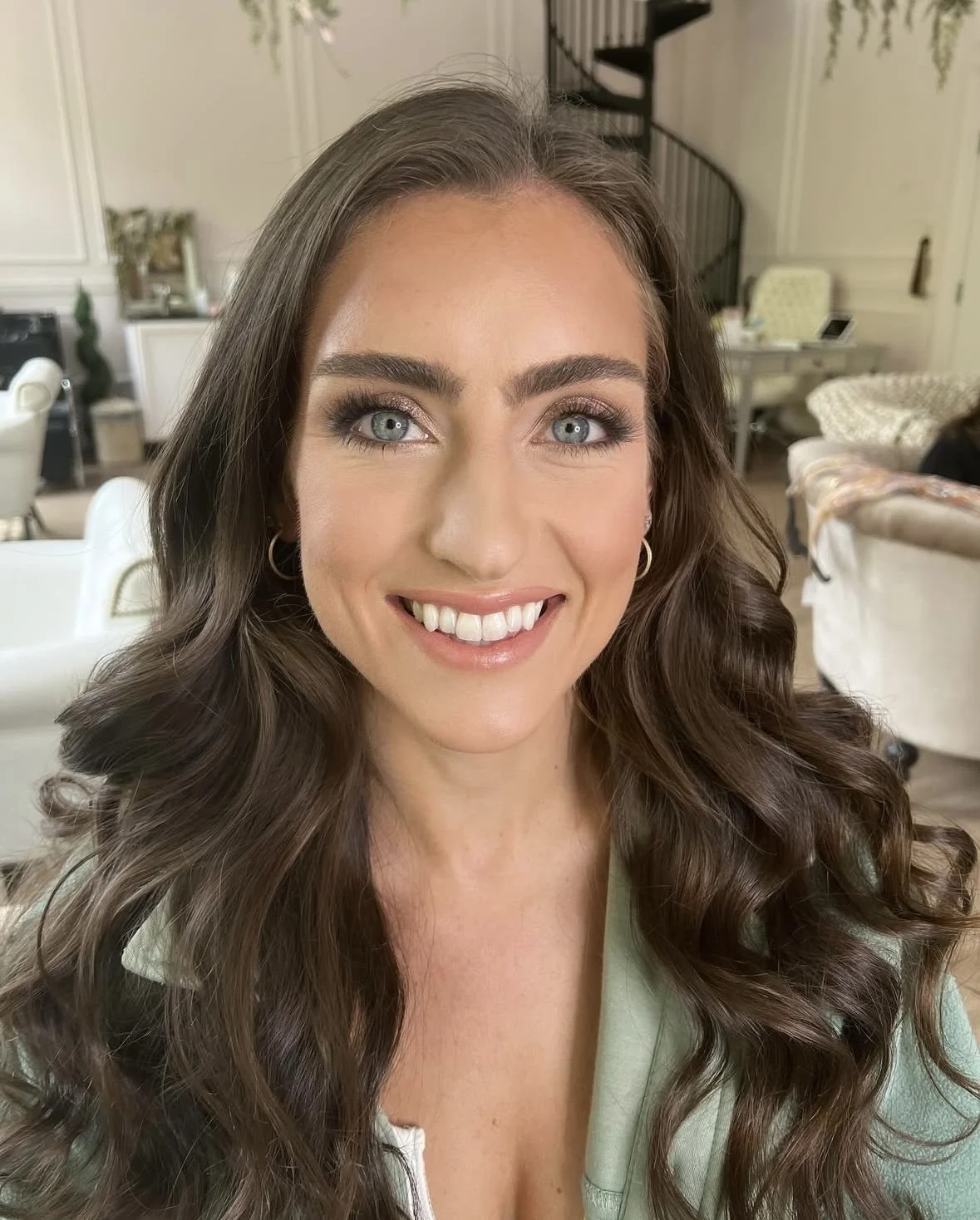 brown haired model with blue eyes thicker eyebrows and long eyelashes