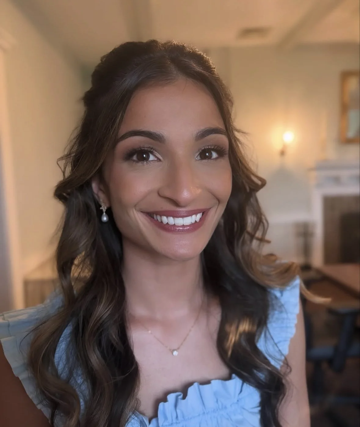 Brown haired bridesmaid wearing a blue top