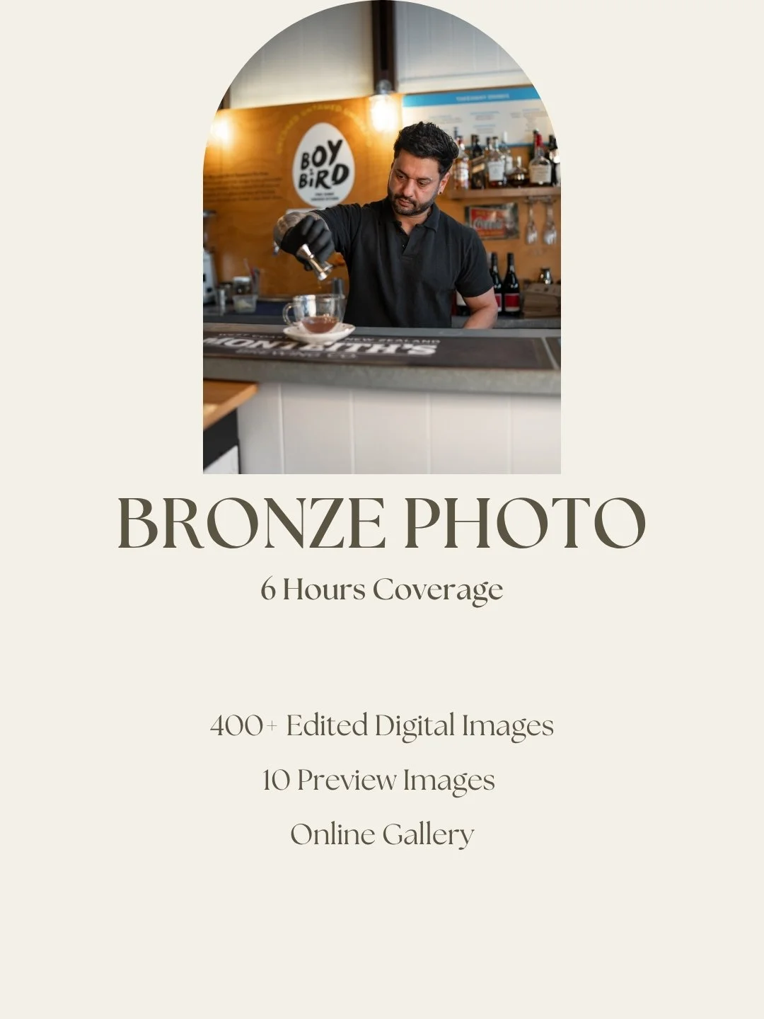 A man wearing a black shirt and black glove, preparing a drink with a pour-over coffee setup in a café with a wooden interior and a sign that says "Boy Bird" in the background.