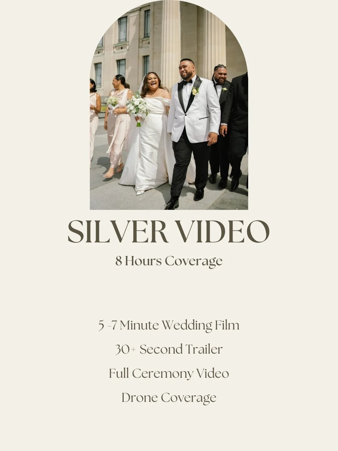 People in wedding attire walking outside a building with columns, smiling and holding bouquets.