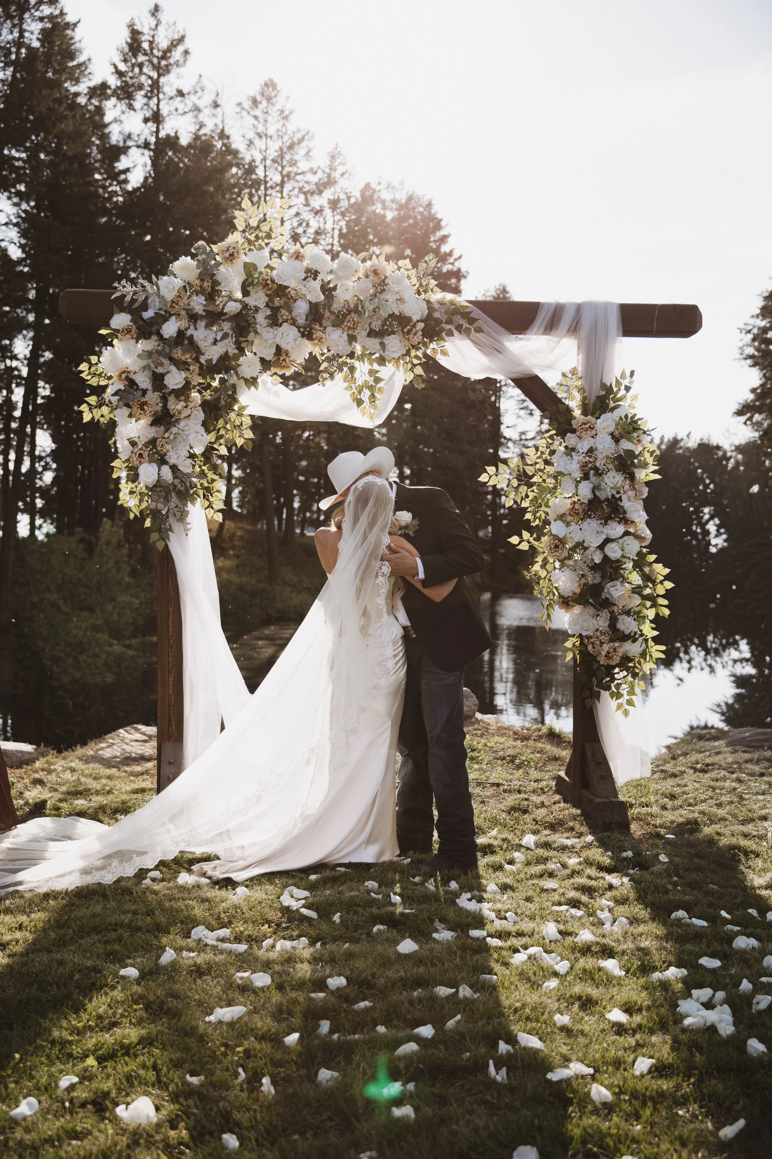 JA_Ceremony_Arch Kiss.jpg