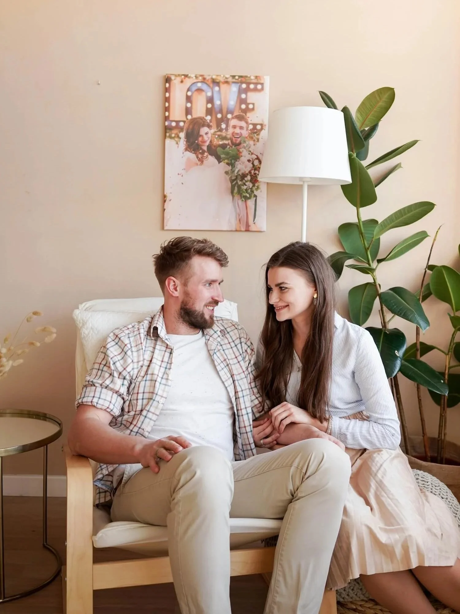 Couple sitting closely and talking warmly in a living room, therapist for couples Blue Mountains