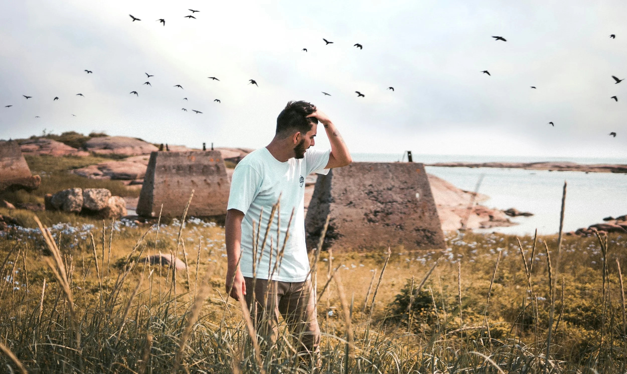 anxious man rubbing his head seeking answers