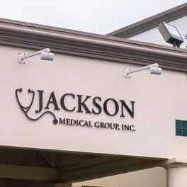 Sign for Jackson Medical Group Inc. on a building exterior.
