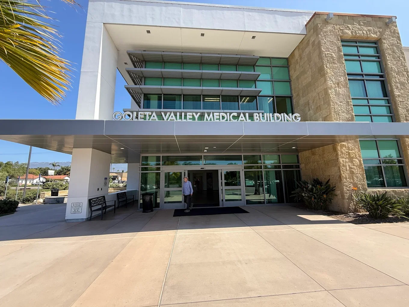 Exterior view of Goleta Valley Medical Building with entrance, glass doors, and sign above entryway.