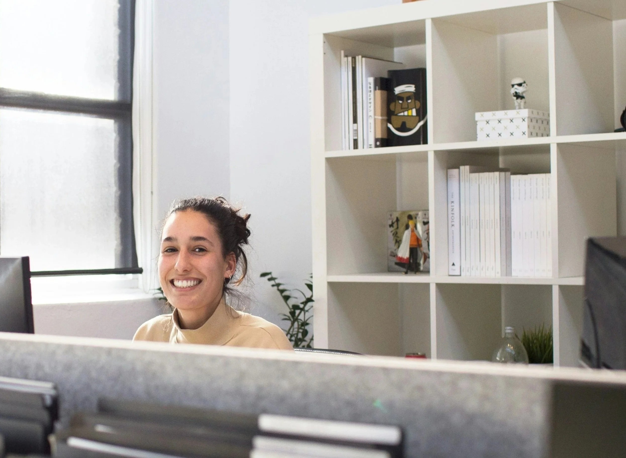 Team member working in a bright office environment.
