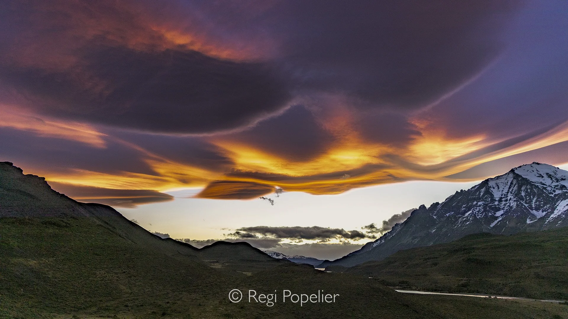 CHILI004 - The weather turns without warning. Clouds erupt into color, borne by the wind, and the sun lingers—present, but only partly faithful to her role.