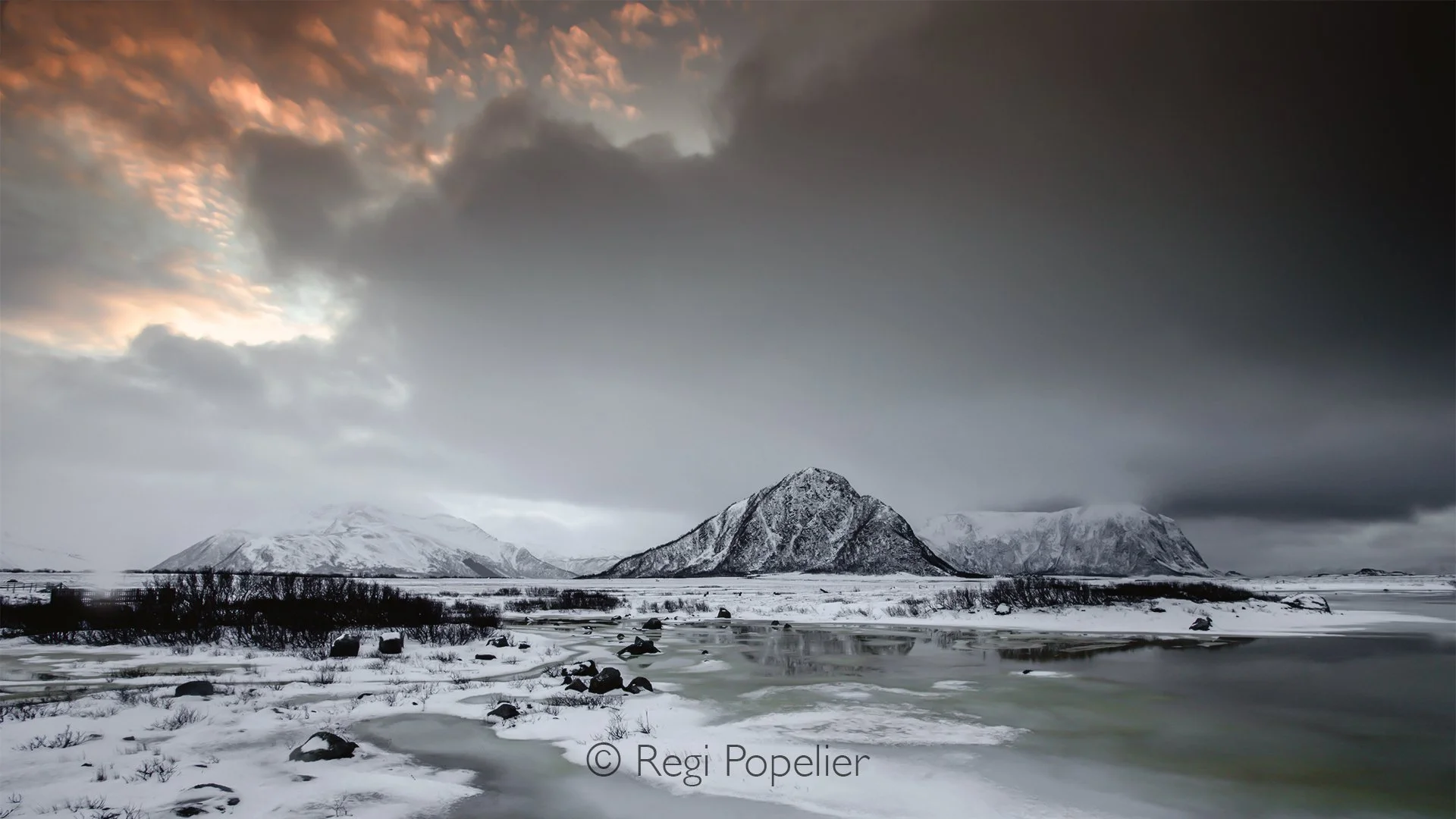 NORWAY014 - Nature paints with only a few colors in winter, white snow, blue ice and golden soft morning light.