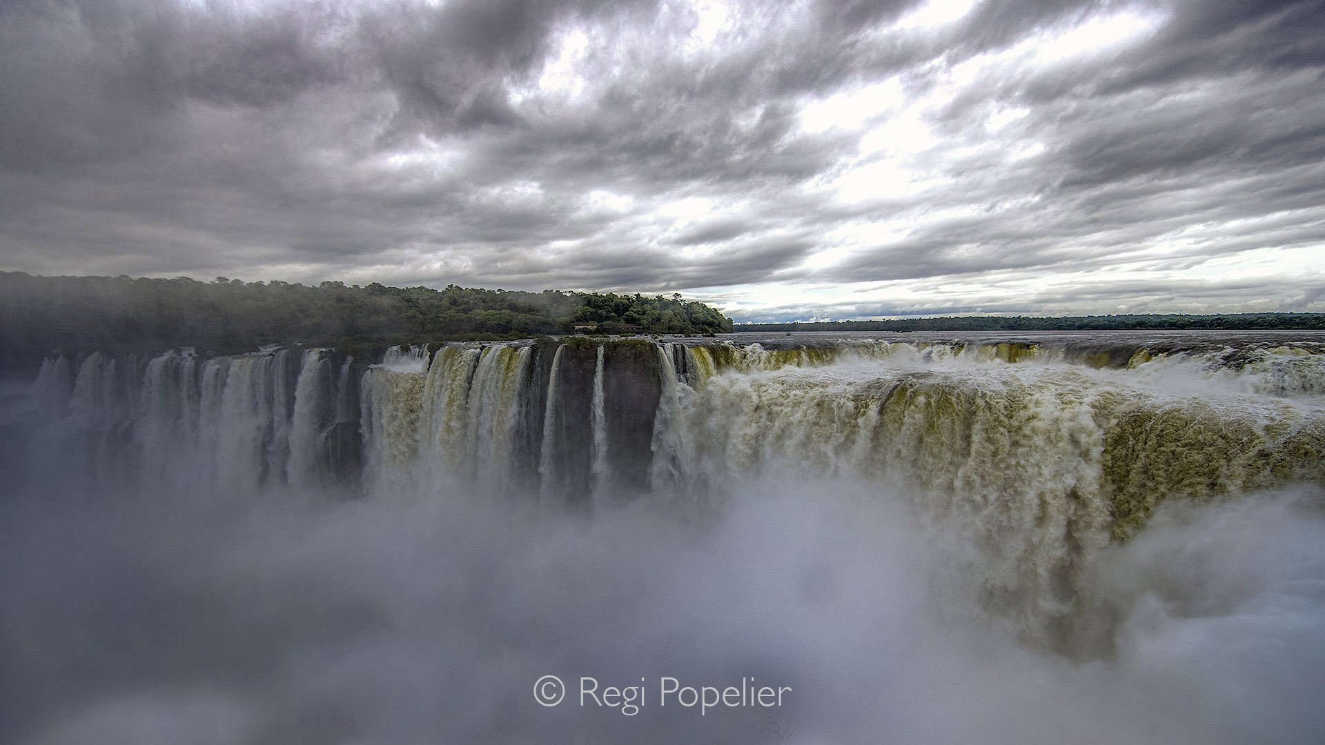 ARG003 - The Gorge at Iguassu Falls, fog rising, water thundering like a tomb, and a display of sheer grandeur.
