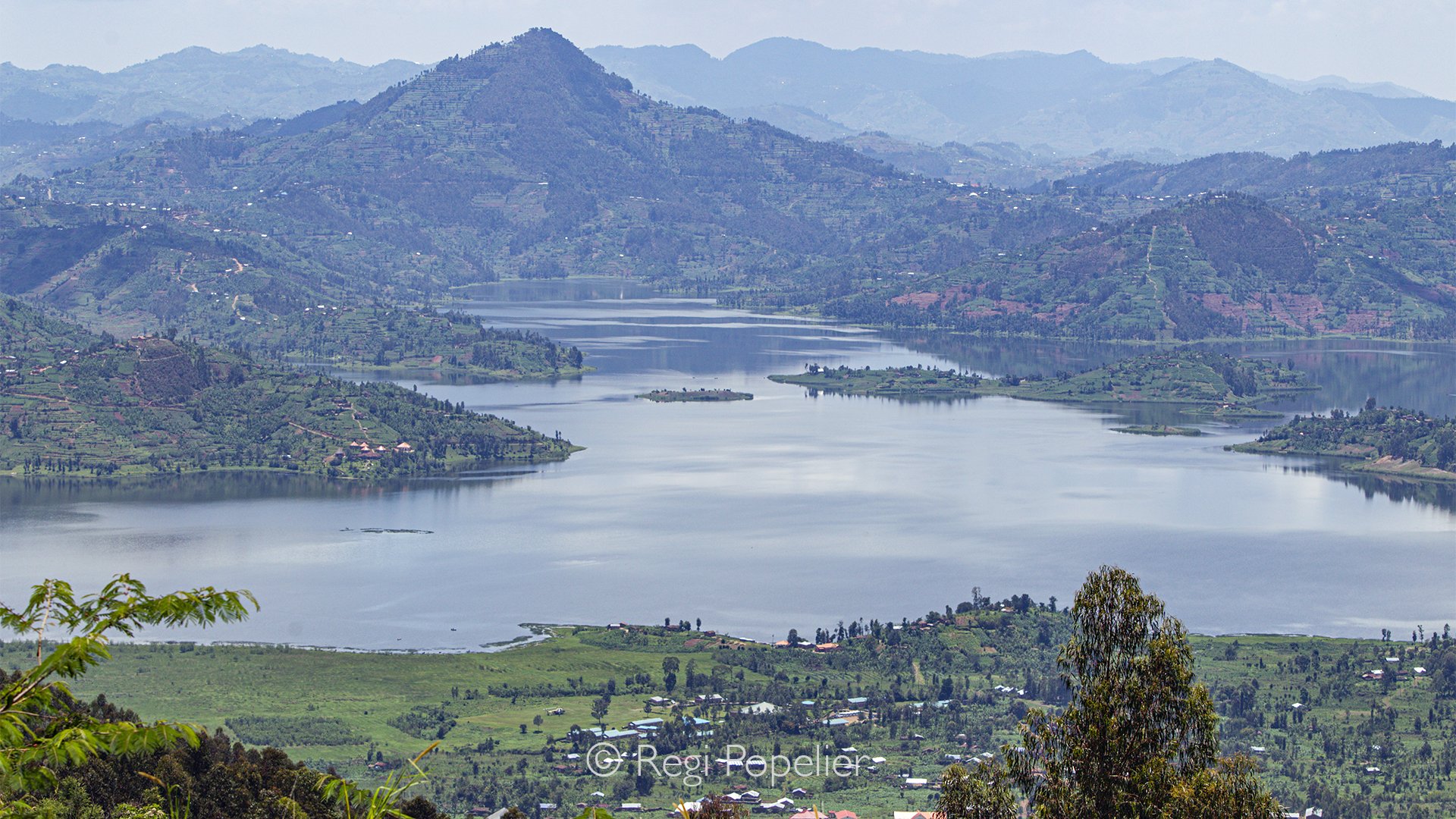 RWANDA032 - The Virunga Mountains provide an unforgettable backdrop throughout the day. From brilliant sunrise to glowing sunset, the changing light continuously reshapes this spectacular volcanic landscape, reminding me that every moment offers a ne