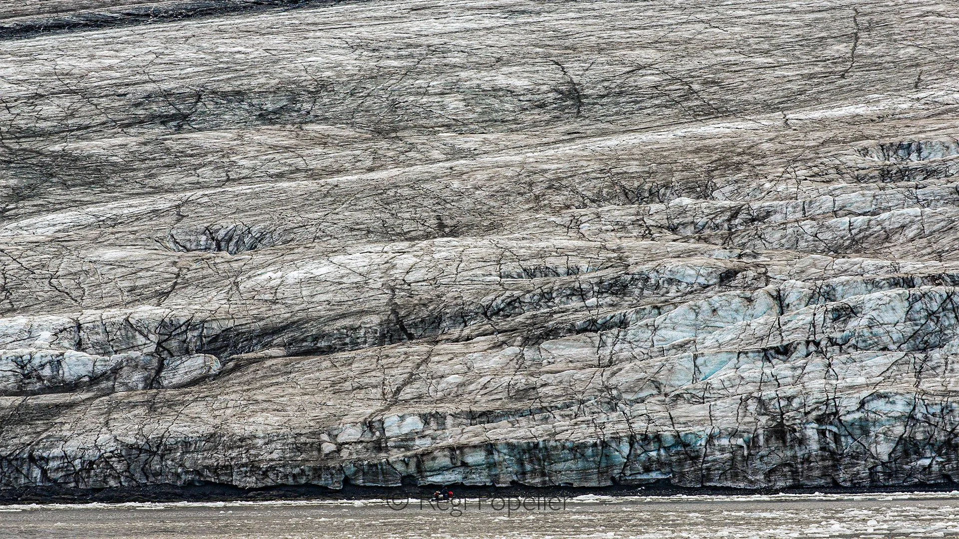 NPOLE013 - In front of these colossal glacier walls, we are merely a grain in the Arctic wilderness, witnessing one of nature's greatest spectacles.