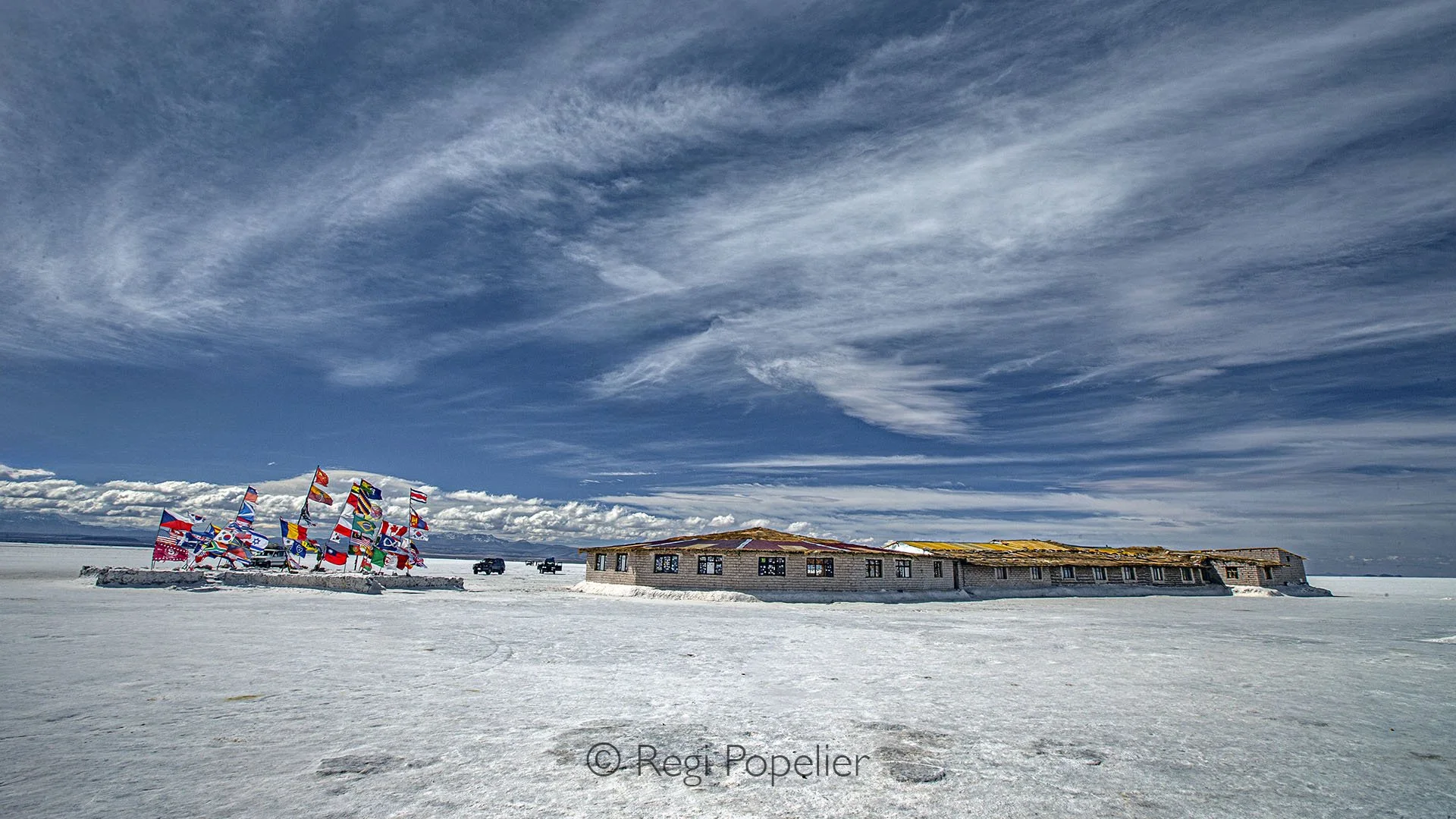 BOL010 - The Dakar Monument in Uyuni, created in 2014, has become an iconic symbol of the salt desert and a famous spot for tourists, now just  a memory of adventure past.