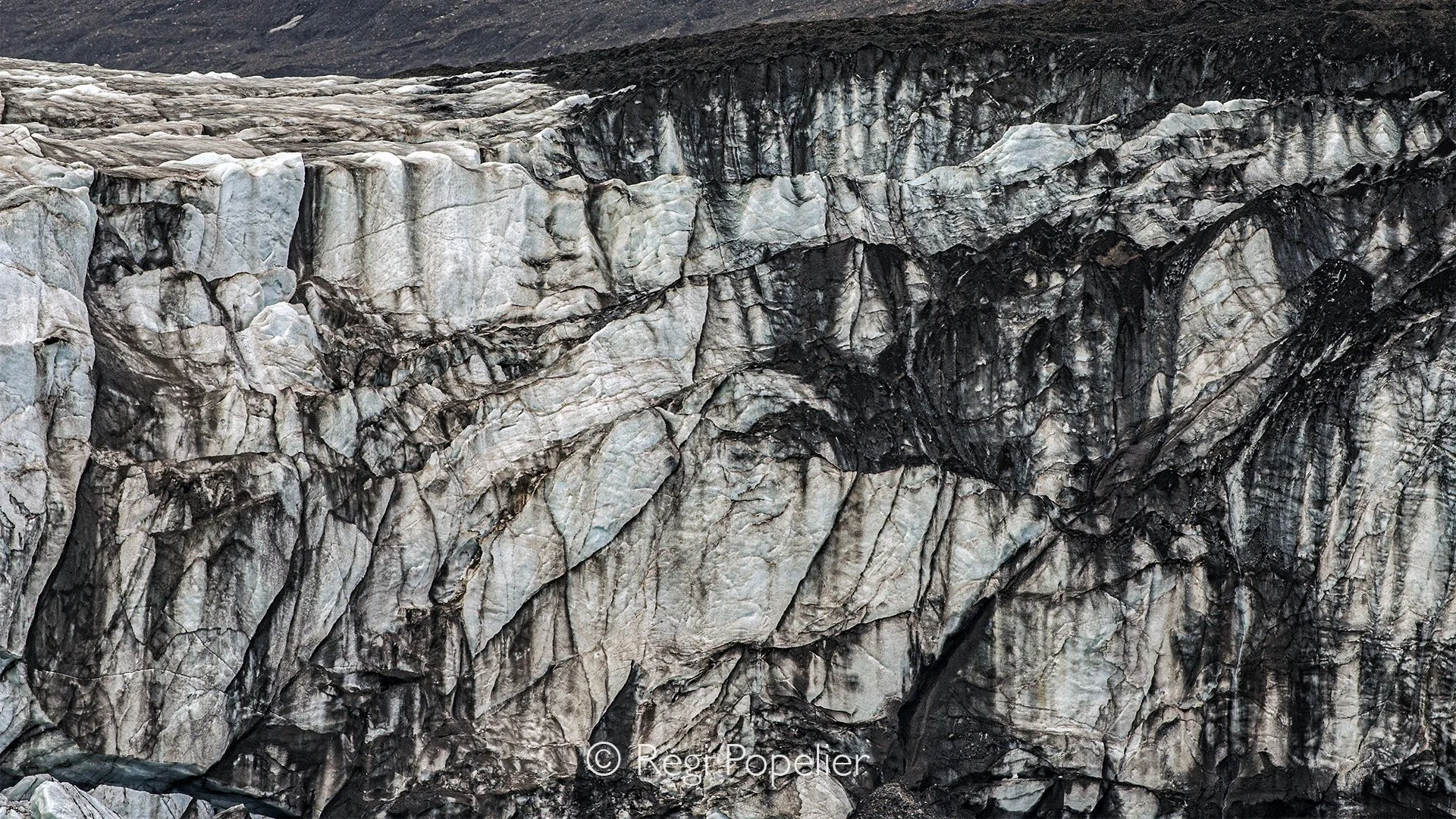 NPOLE012 - Frozen Art
A fascinating detail of the glacier, where light, ice, and time combine to form extraordinary natural designs.