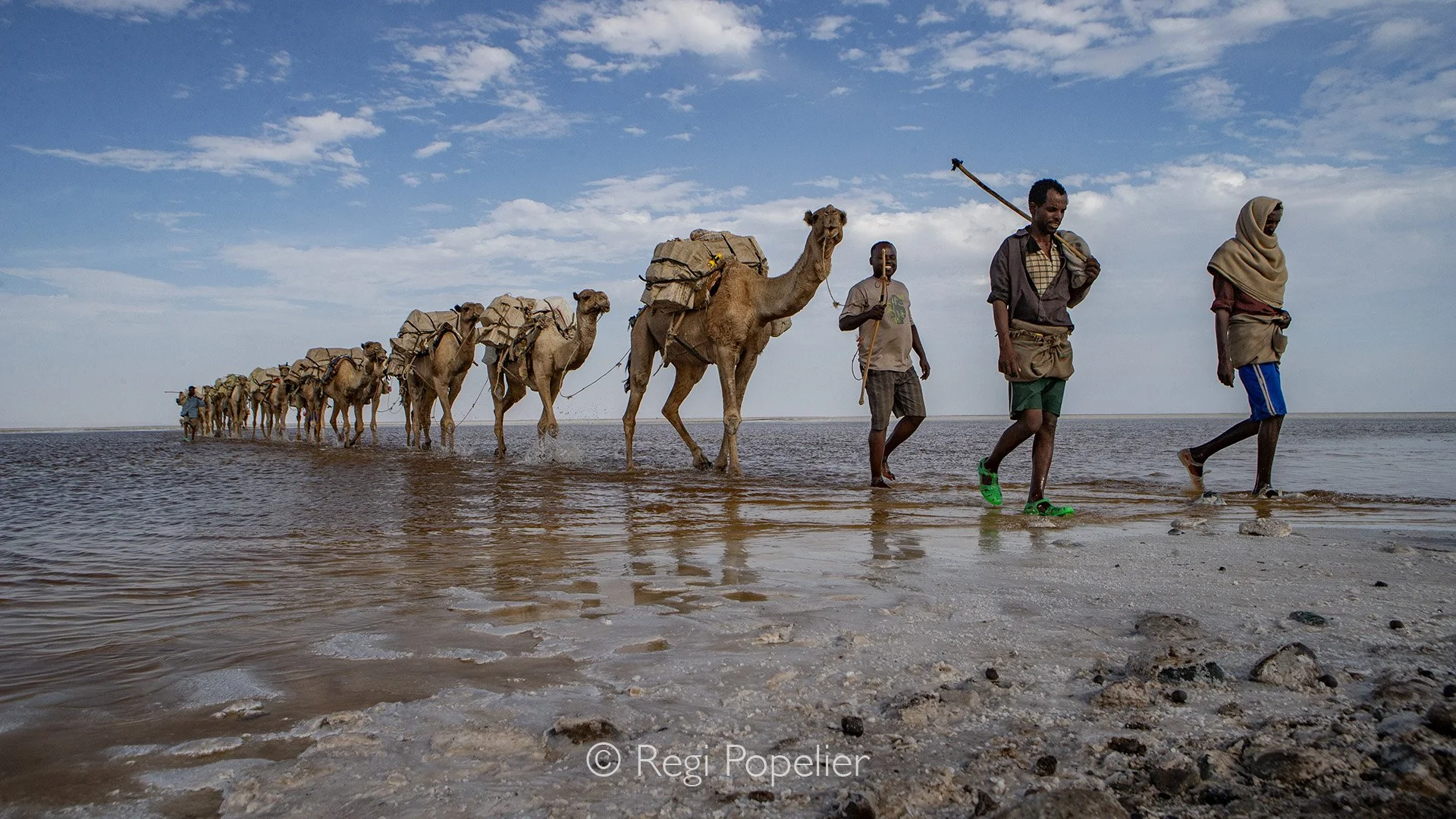 ETH037 - Although a long way to cover , the smile is present on the face of the people