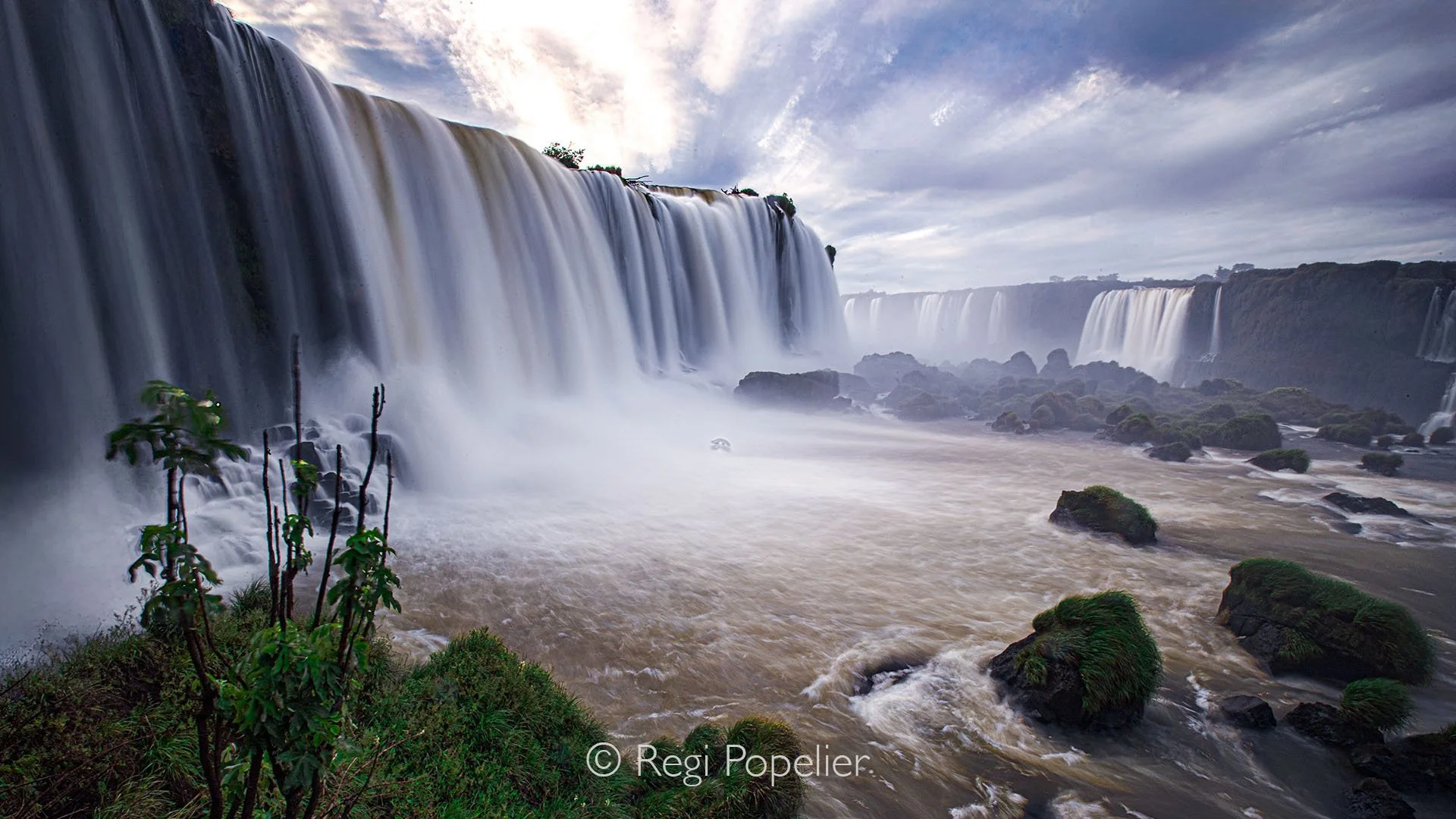BRA002 - Amazing view of Iguassu Falls from the Brazilian side, where immense power meets misty beauty, and the roar of water echoes through one of the world’s greatest natural wonders.