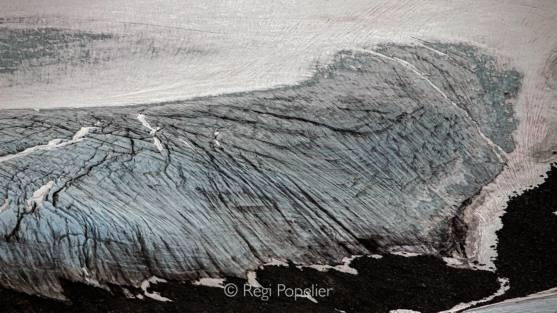NPOLE007  - Towering walls of glacier ice rise like a natural monument.