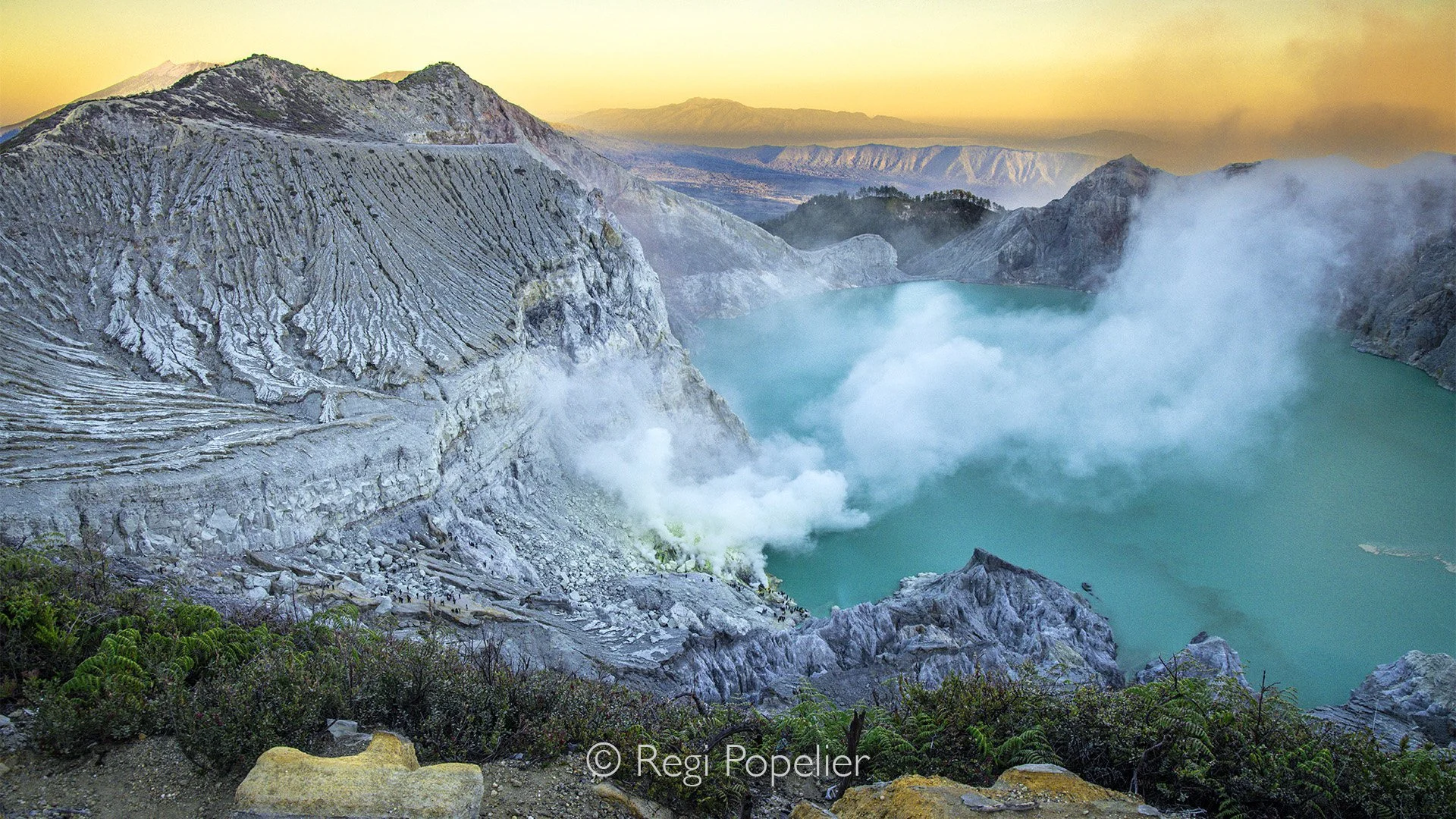 INDO096 - Taken from above, the image captures the spectacle of steam rising from the grotto where sulfur is collected