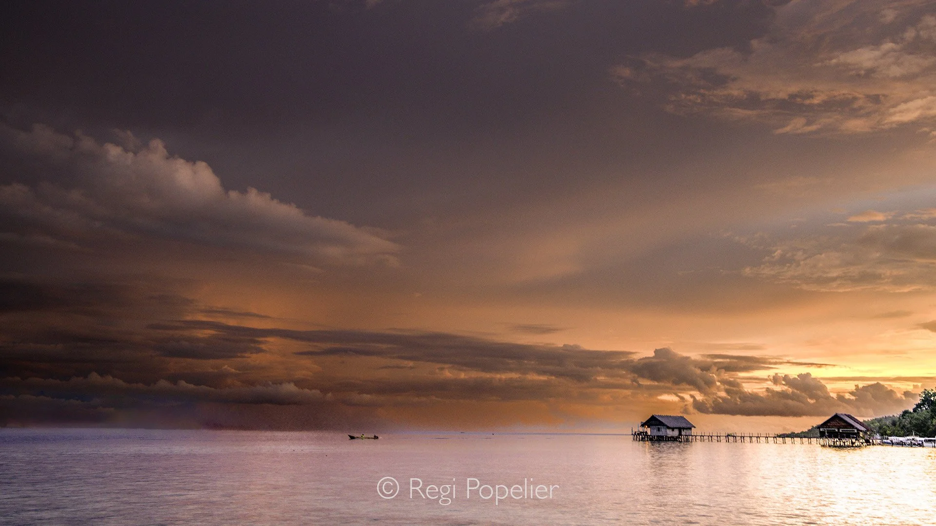 INDO097 -After my stay in West Papua, I joined my family to explore Raja Ampat, this image shows the area at sunset of our stay there. 