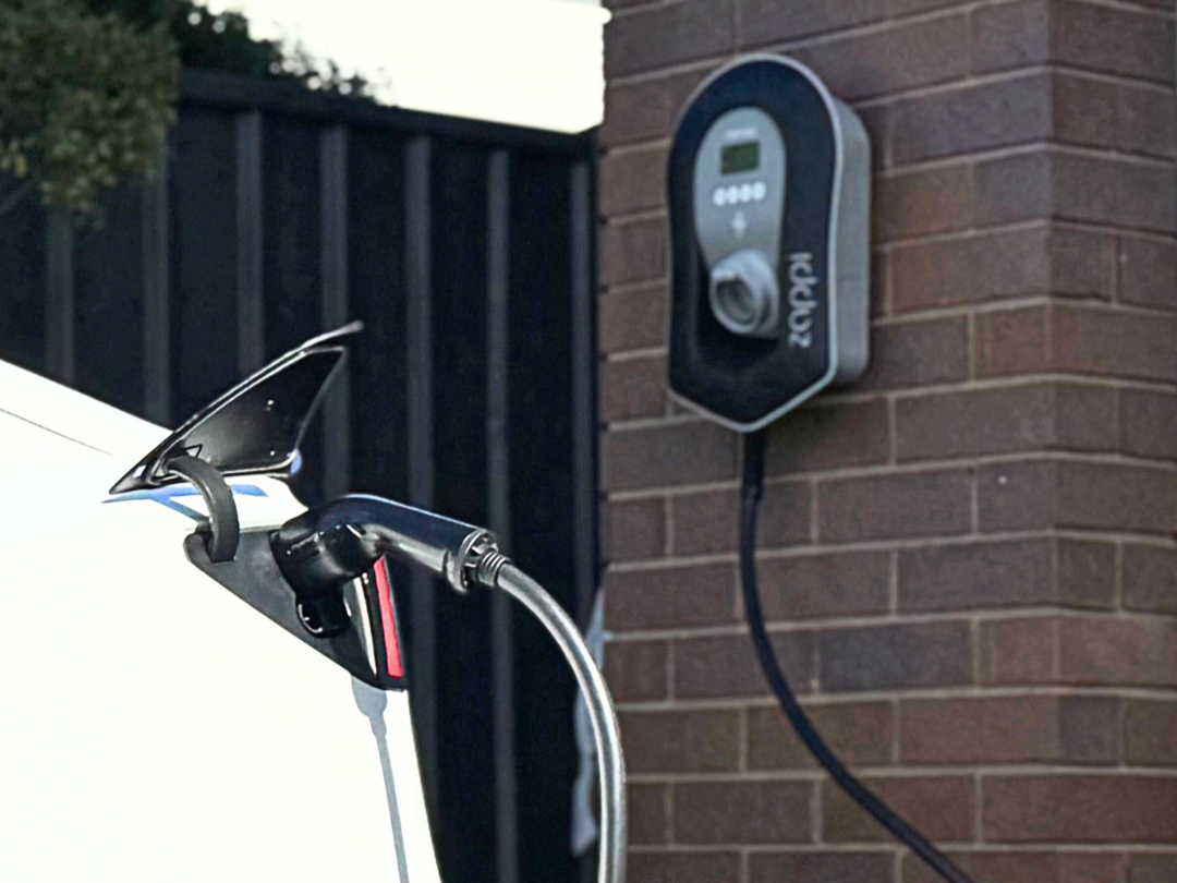 EV charger installation with cable plugged in — part of Zamps Electrical's residential charging solutions.