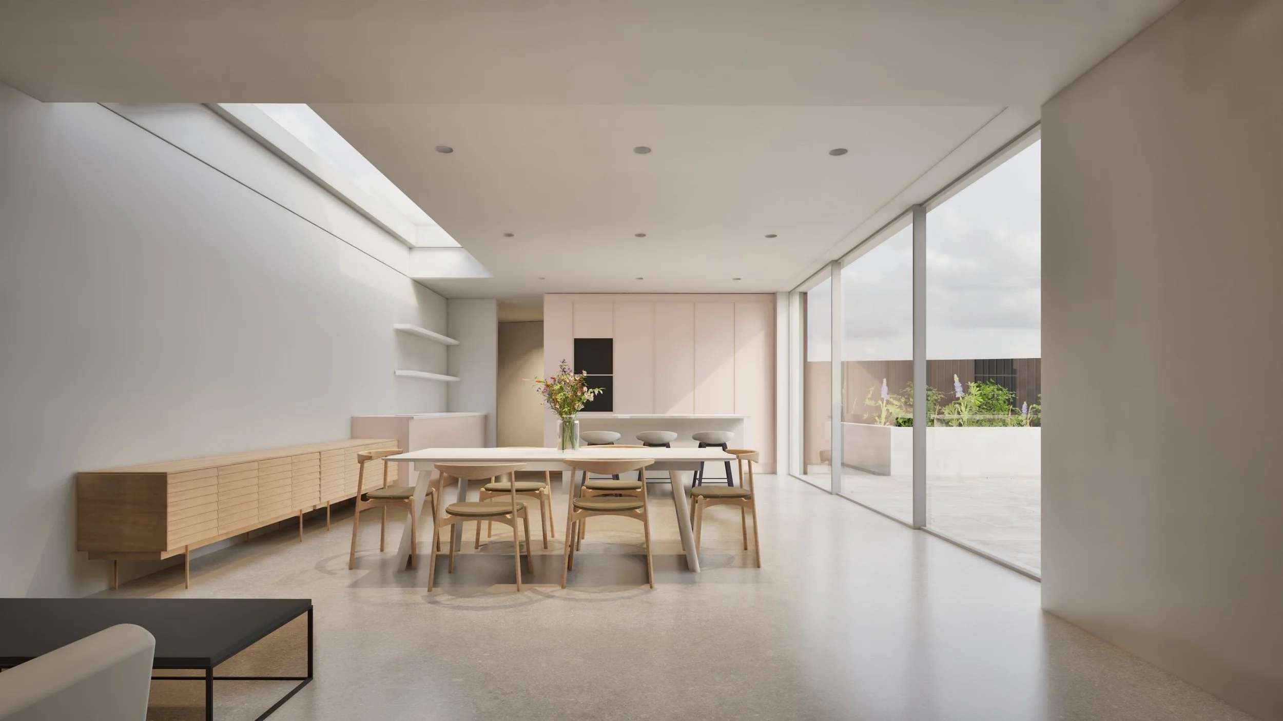 Minimalist dining room with a large oval wooden dining table, eight matching chairs, a vase with flowers, built-in wall cabinets, and large sliding glass doors leading to an outdoor patio with plants.