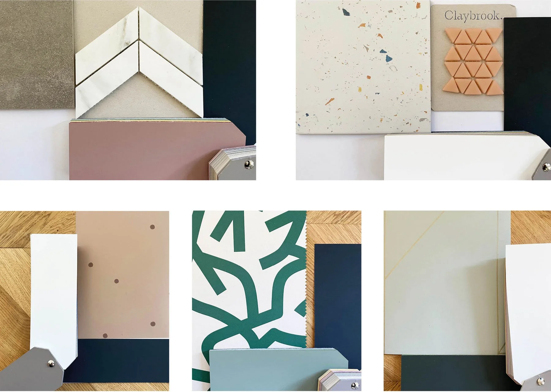Arrangement of various interior design materials and sample tiles, paint swatches, and color palettes displayed on surfaces with different textures and patterns.