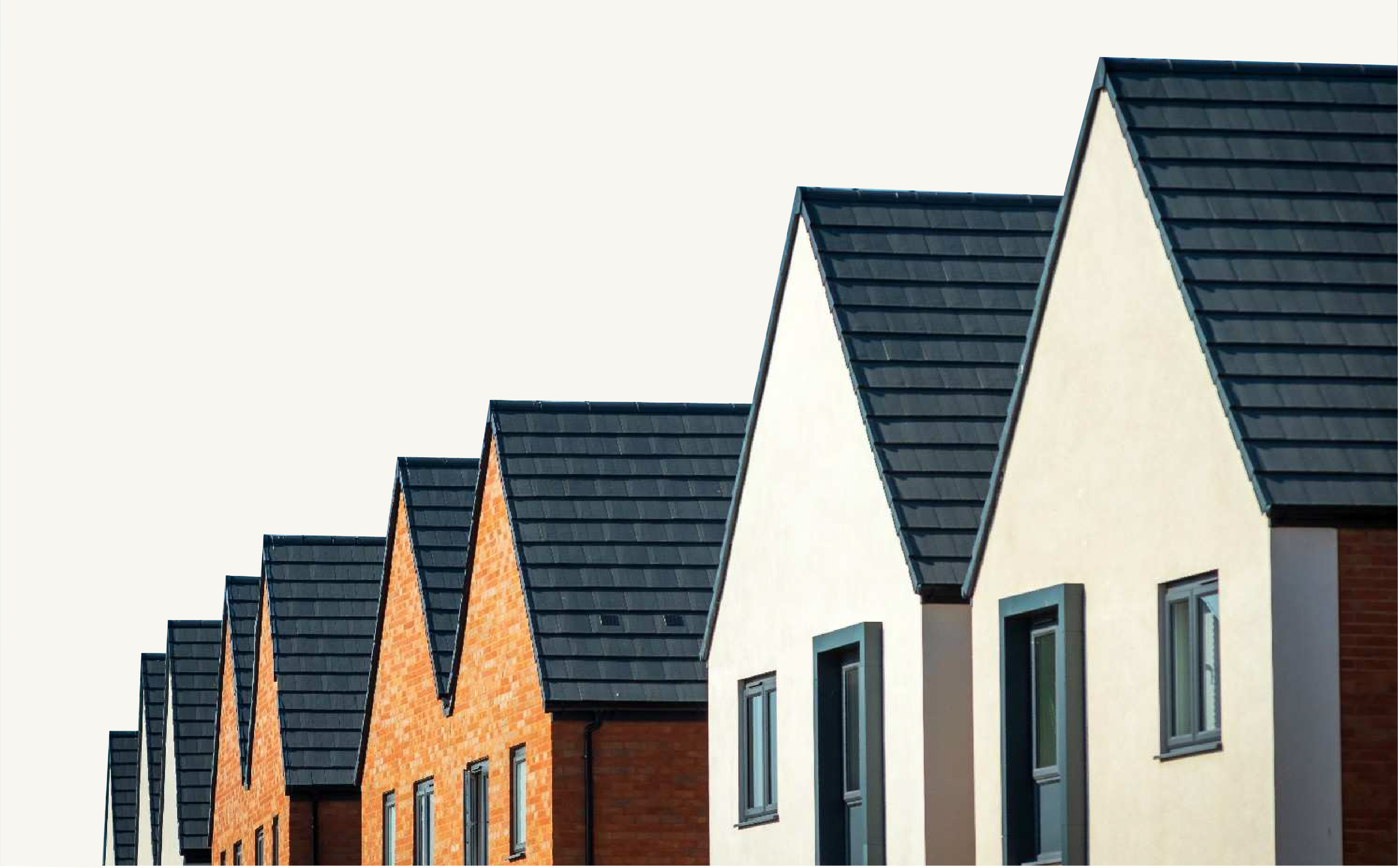 Row of modern houses with dark roofs, white and brick walls, and windows, against a clear sky.