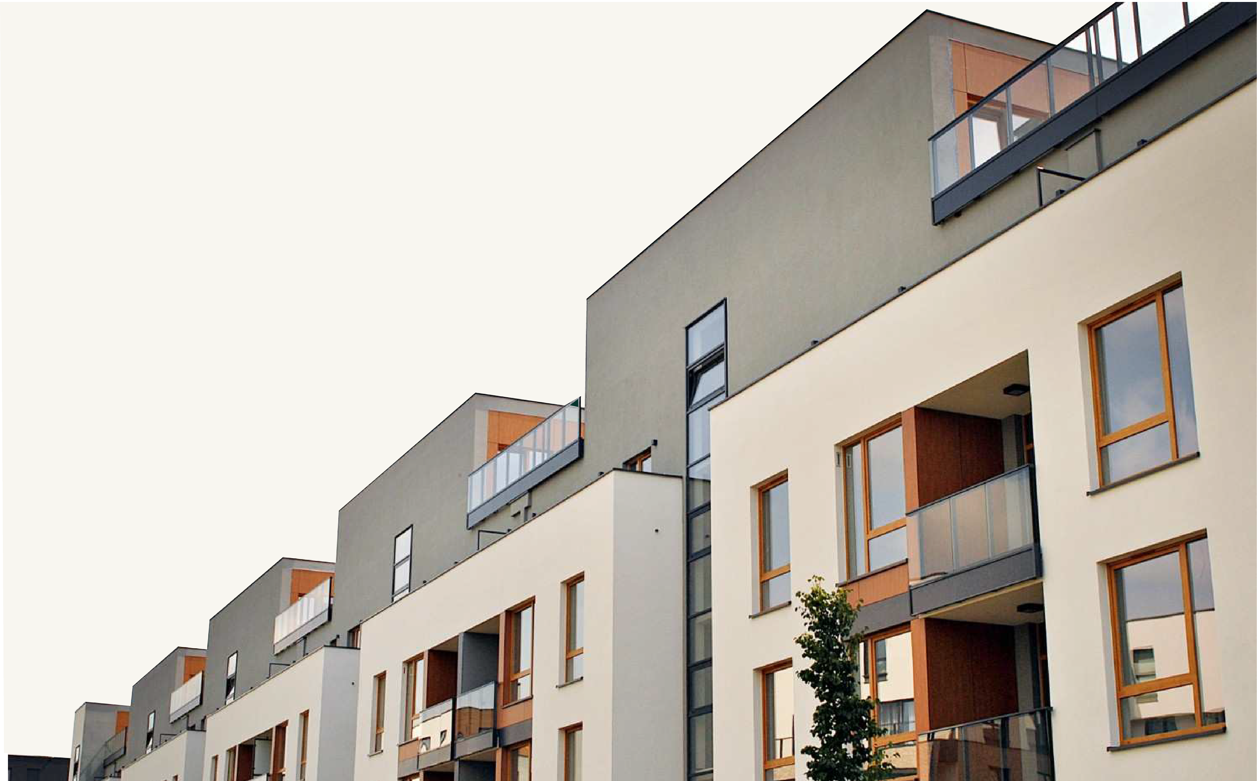 Modern multi-story apartment building with wooden window frames, glass balconies, and a tree in front.