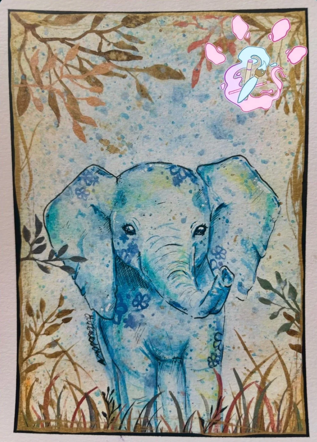 A watercolor painting of a baby elephant surrounded by grass and foliage with a speckled background. There is a sticker of a unicorn in the top right corner.