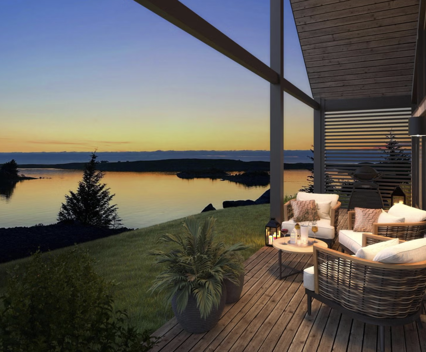 A cozy outdoor patio overlooking a calm river during sunset, with modern furniture, candles, and decorative pillows.