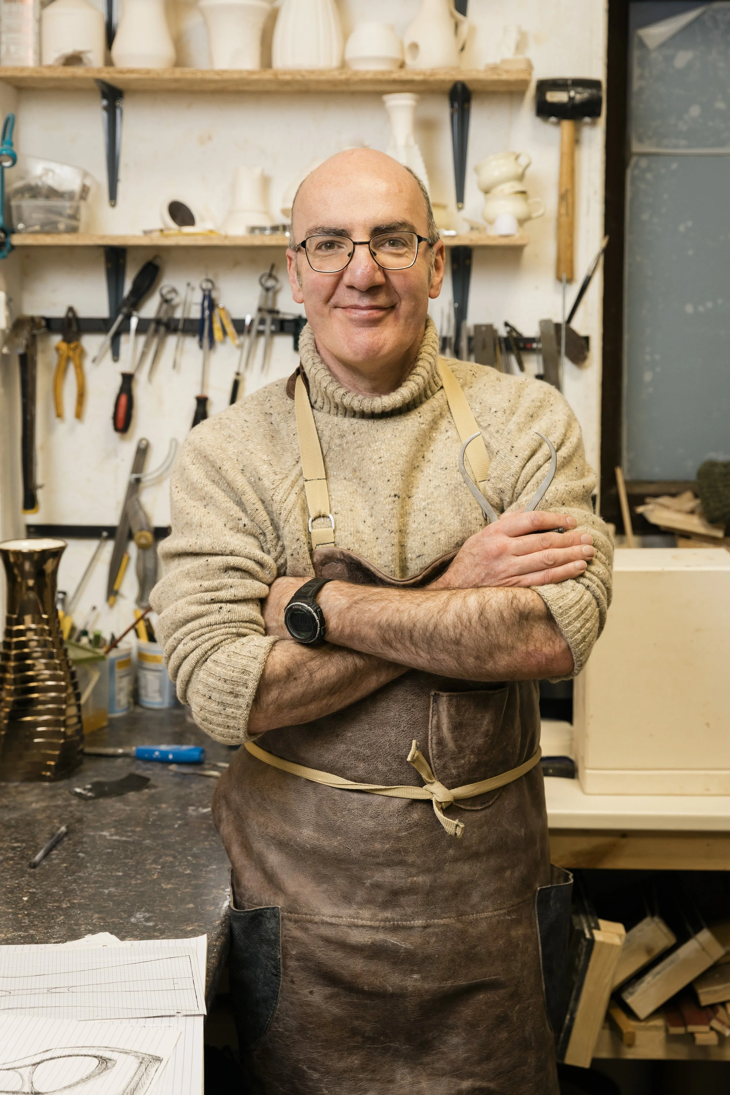 Scottish ceramics designer & maker, Arra Fletcher, smiling in his studio.