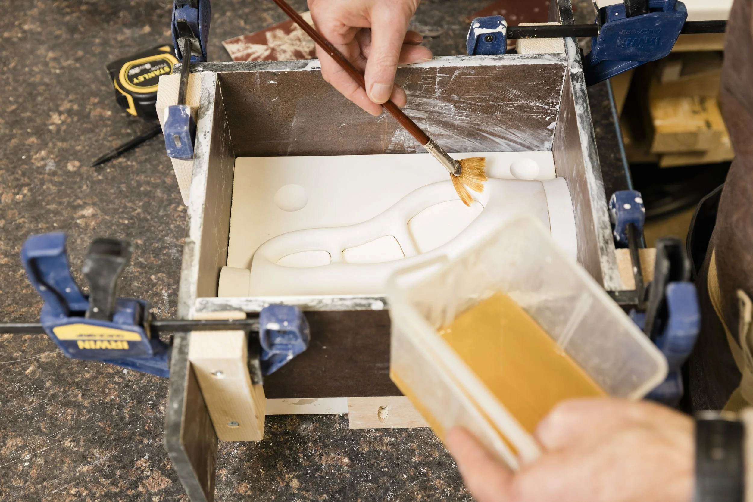 Arra Fletcher working on a mould in his studio.