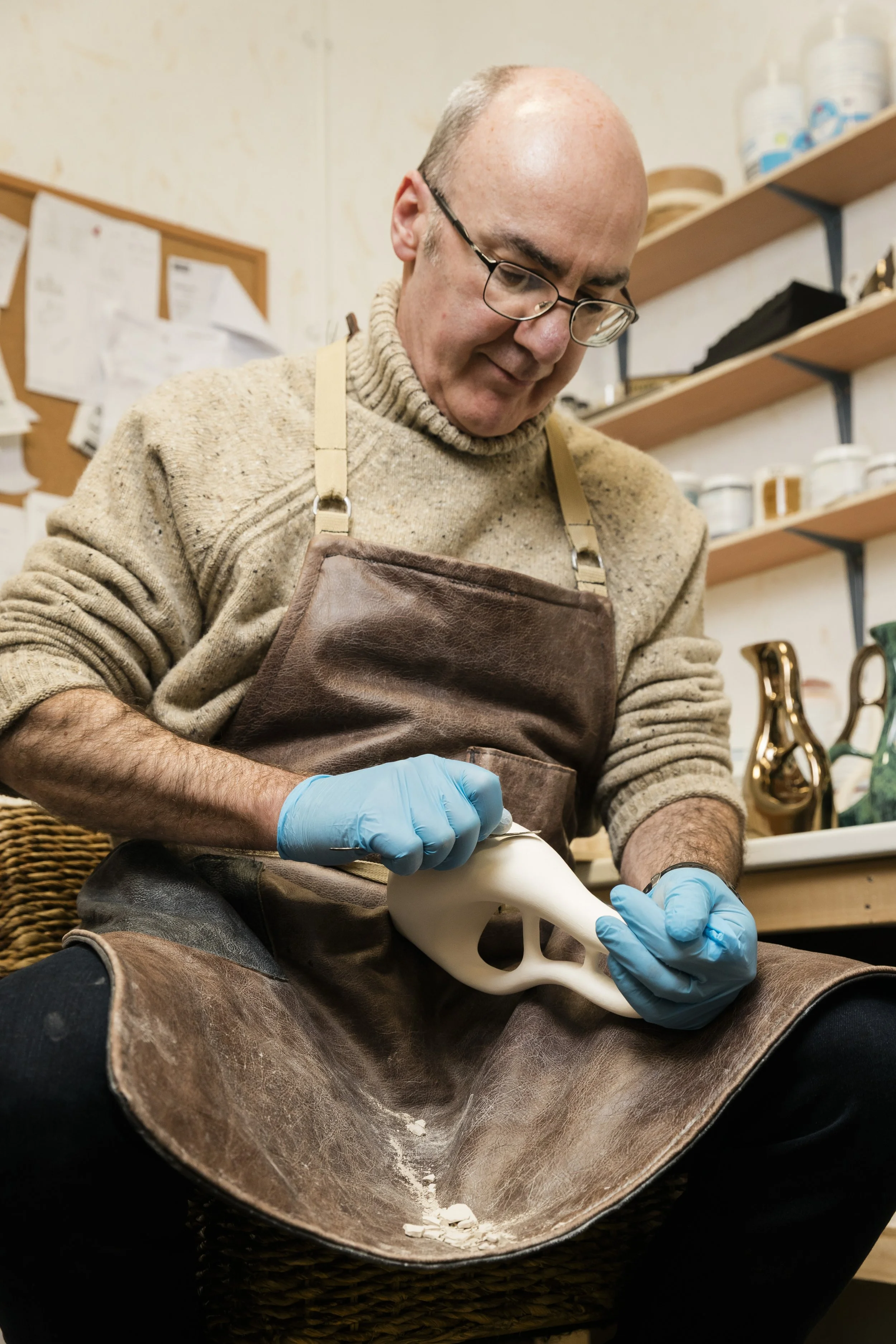 Scottish ceramics designer & maker, Arra Fletcher, fettling in his studio.