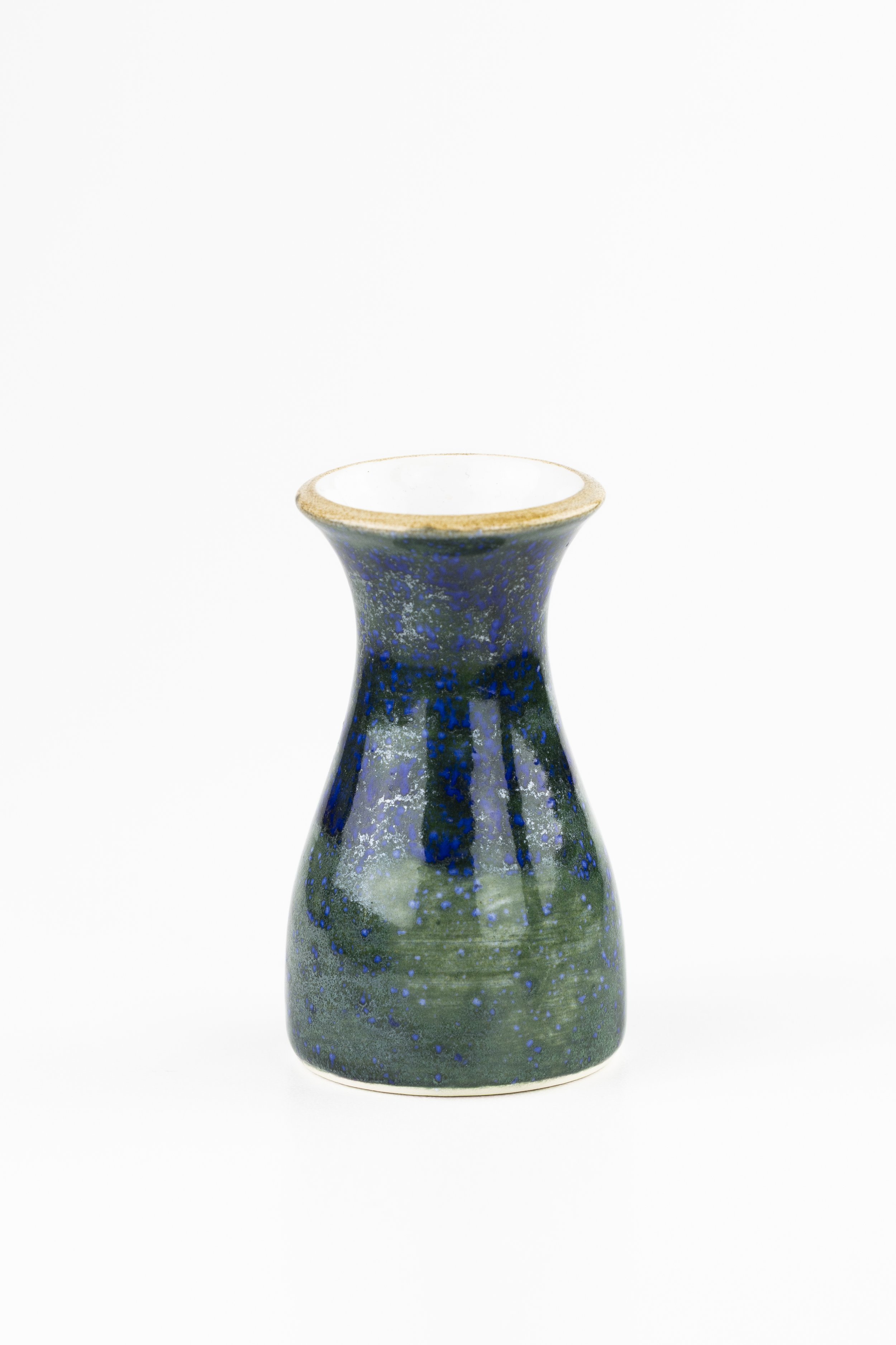 A decorative ceramic vase with a blue and green speckled glaze, set against a plain white background.