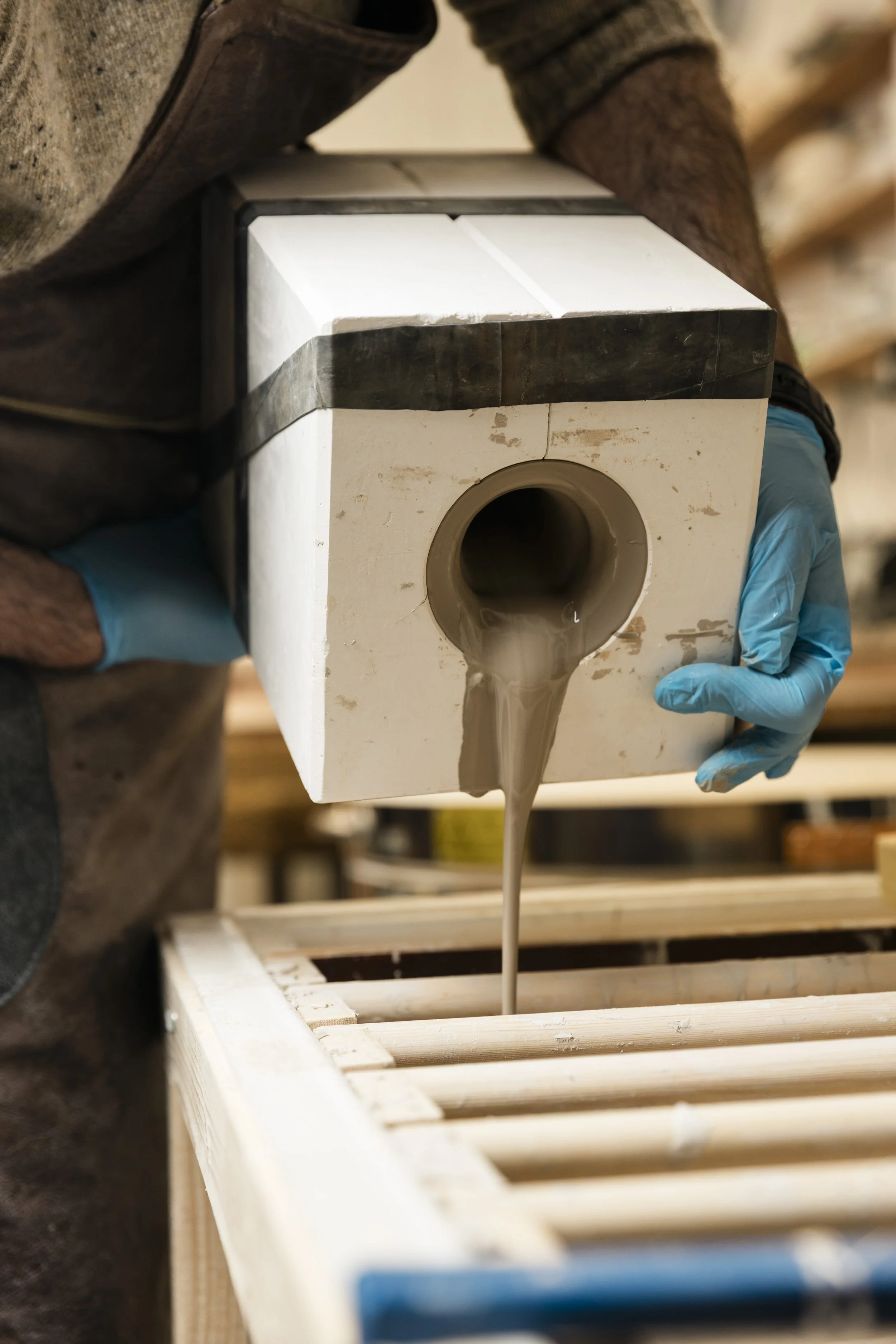 Scottish ceramicist, Arra Fletcher, pouring slip out of a mould.