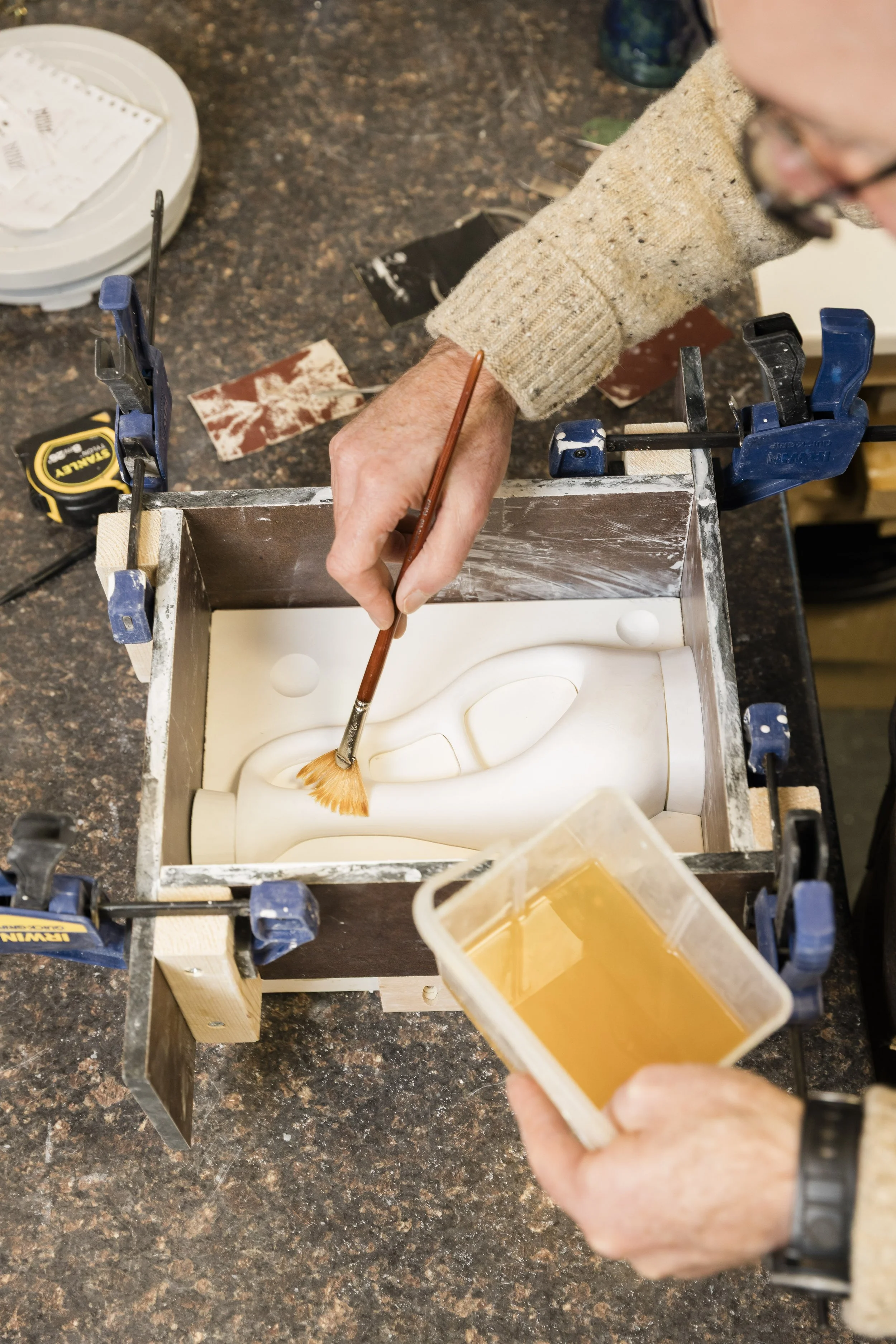 Scottish ceramics designer & maker, Arra Fletcher, working on a mould in his studio.