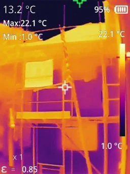 Infrared thermal image of a building interior showing warm and cold areas, with temperature readings indicating 22.1°C at the warmest point and 1.0°C at the coldest.