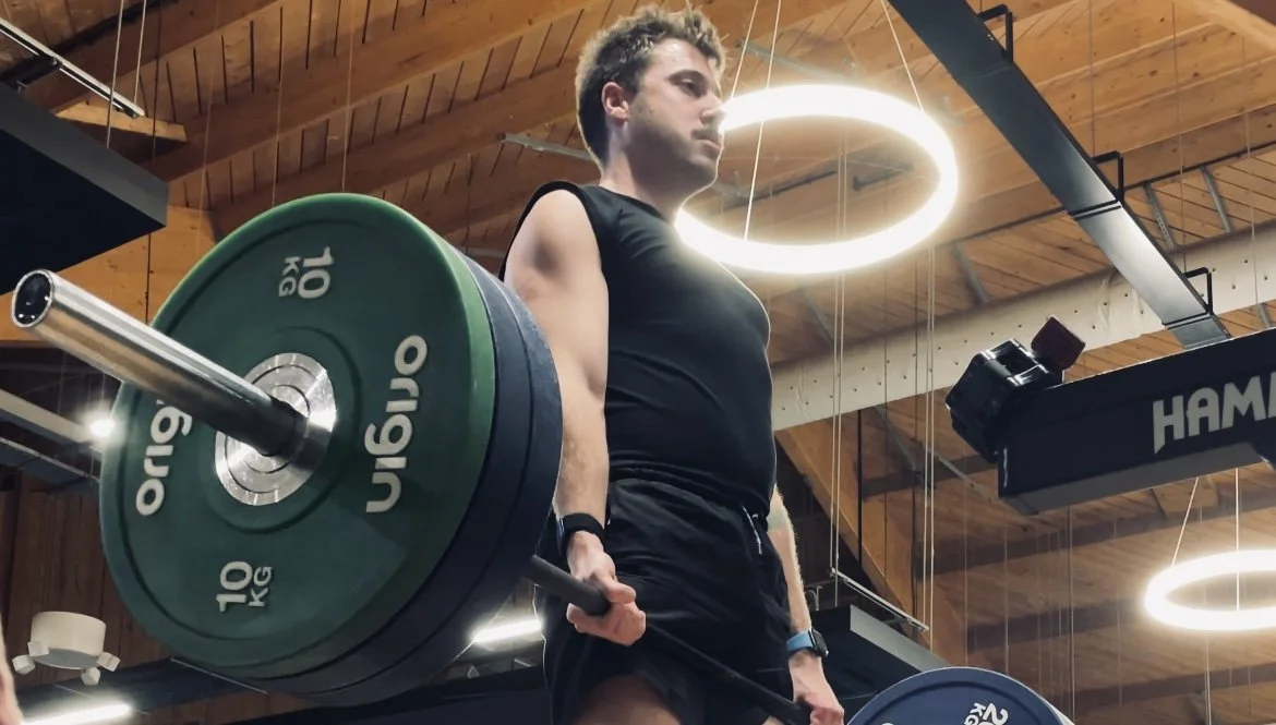 Head Coach Ryan leading by example and demonstrating heavy lifts for strength clients for Online Coaching and Personal training in Eastbourne.