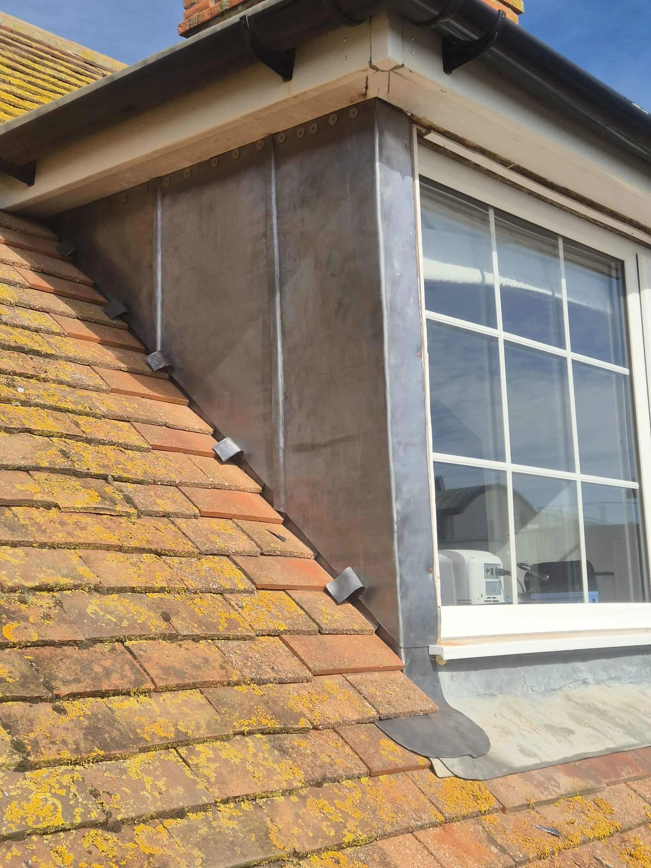 Traditional lead dormer fabricated and installed by Apex Roofing in Bridport