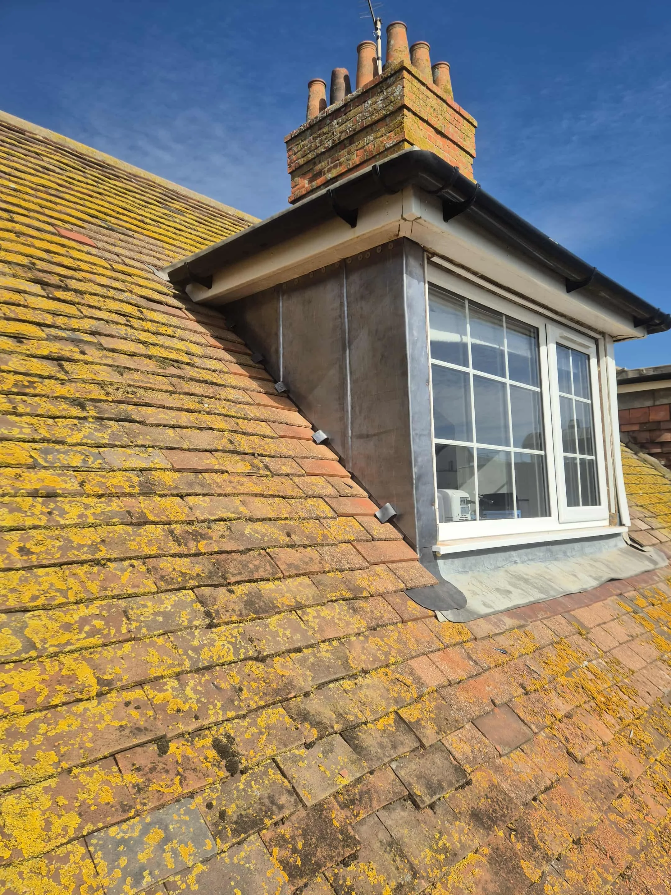 Lead dormer window replacement on a gable roof in Bridport by Apex Roofing & Leadwork