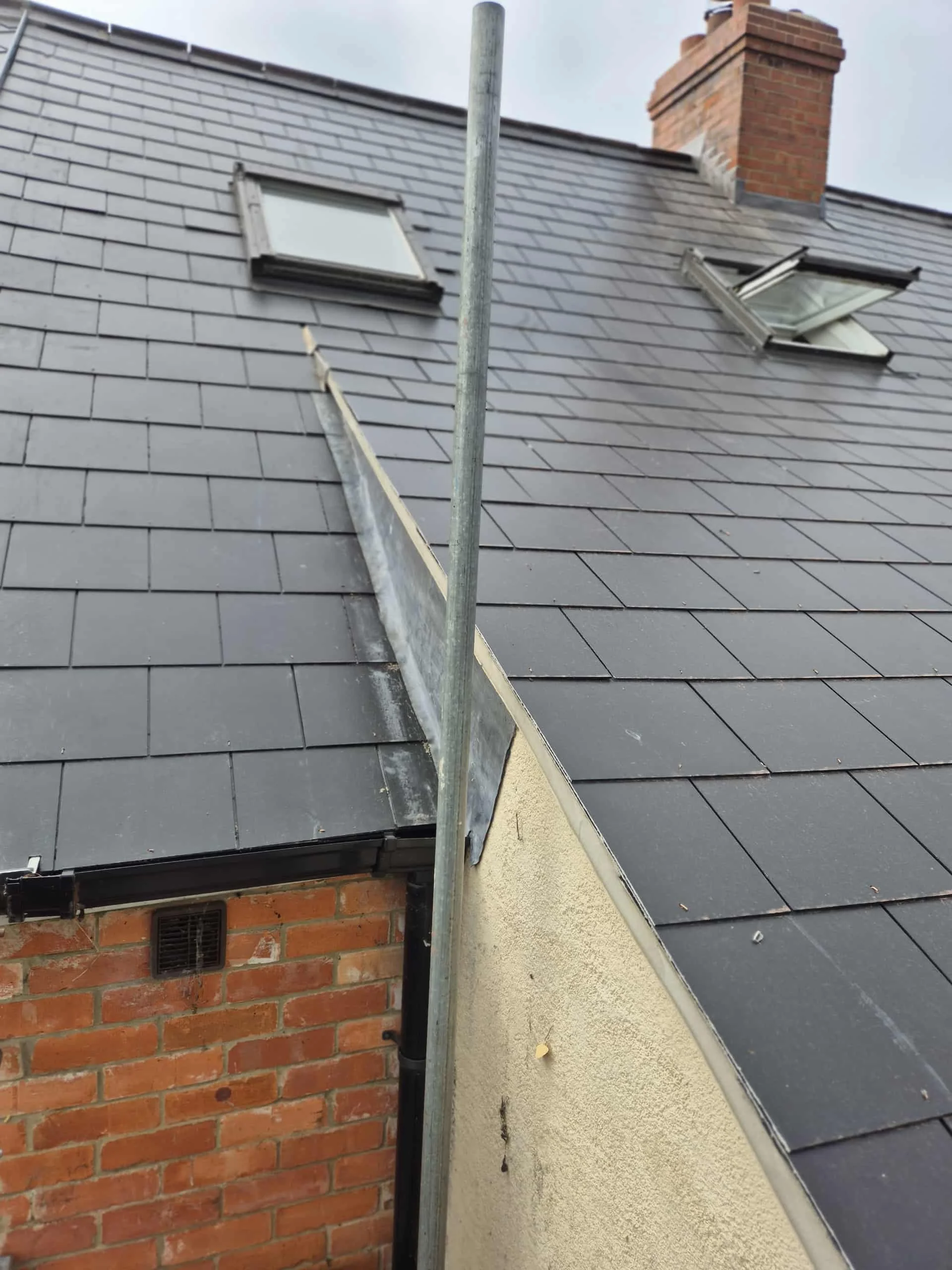 Sky light installation on a slate roof in Lyme Regis by Apex Roofing and Leadwork