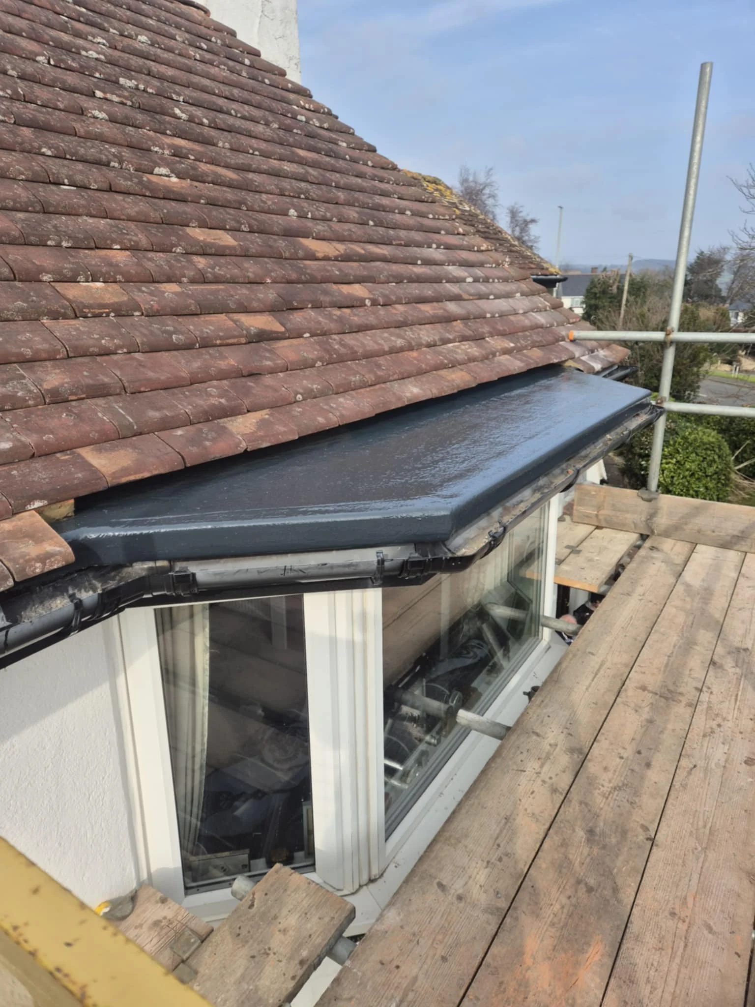 Dormer flat roof finished with GRP laminate by Apex Roofing and Leadwork in Bridport